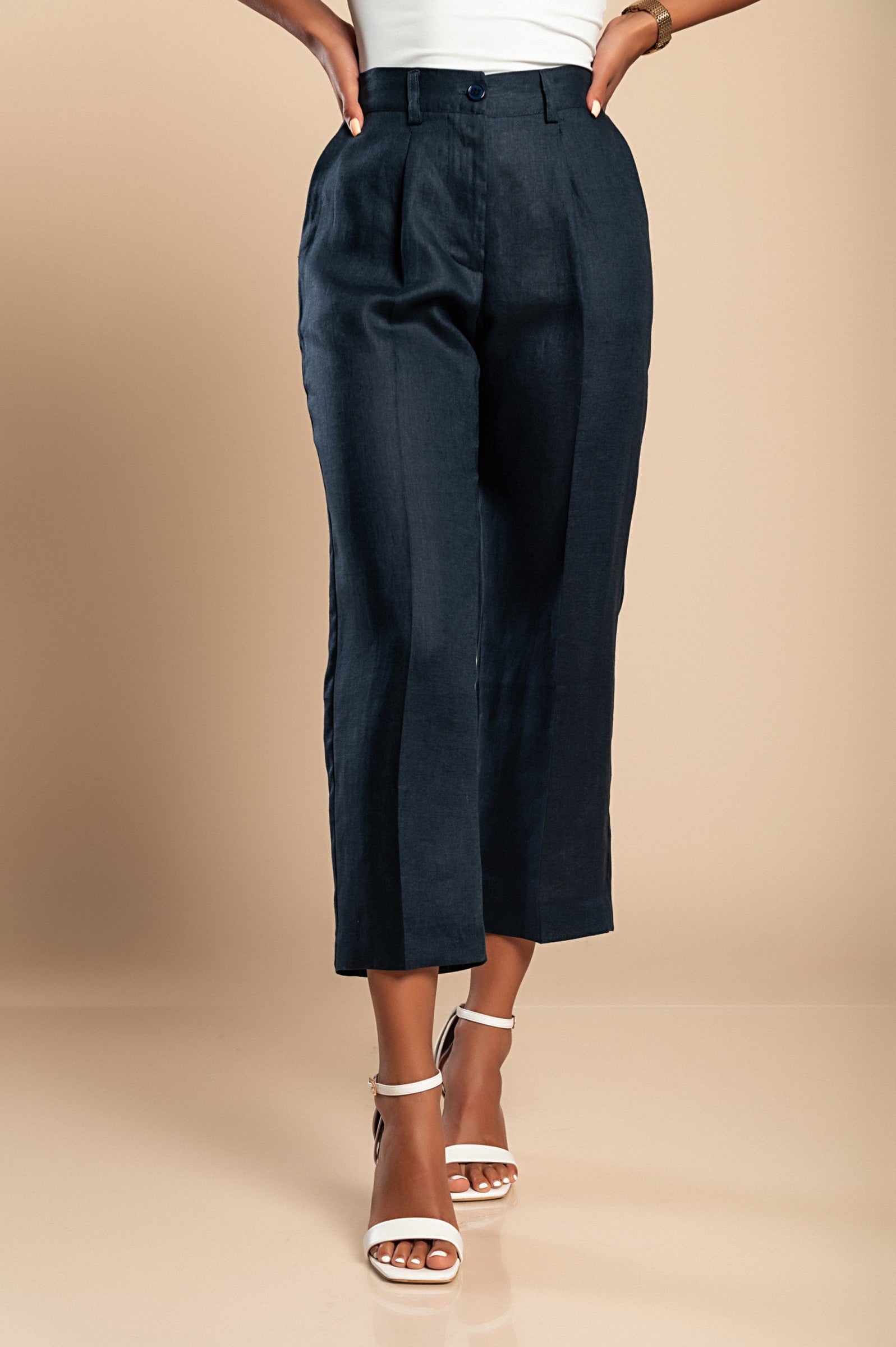 Elegant dark blue linen trousers with elasticated back and side pockets, showcasing a straight-cut design.