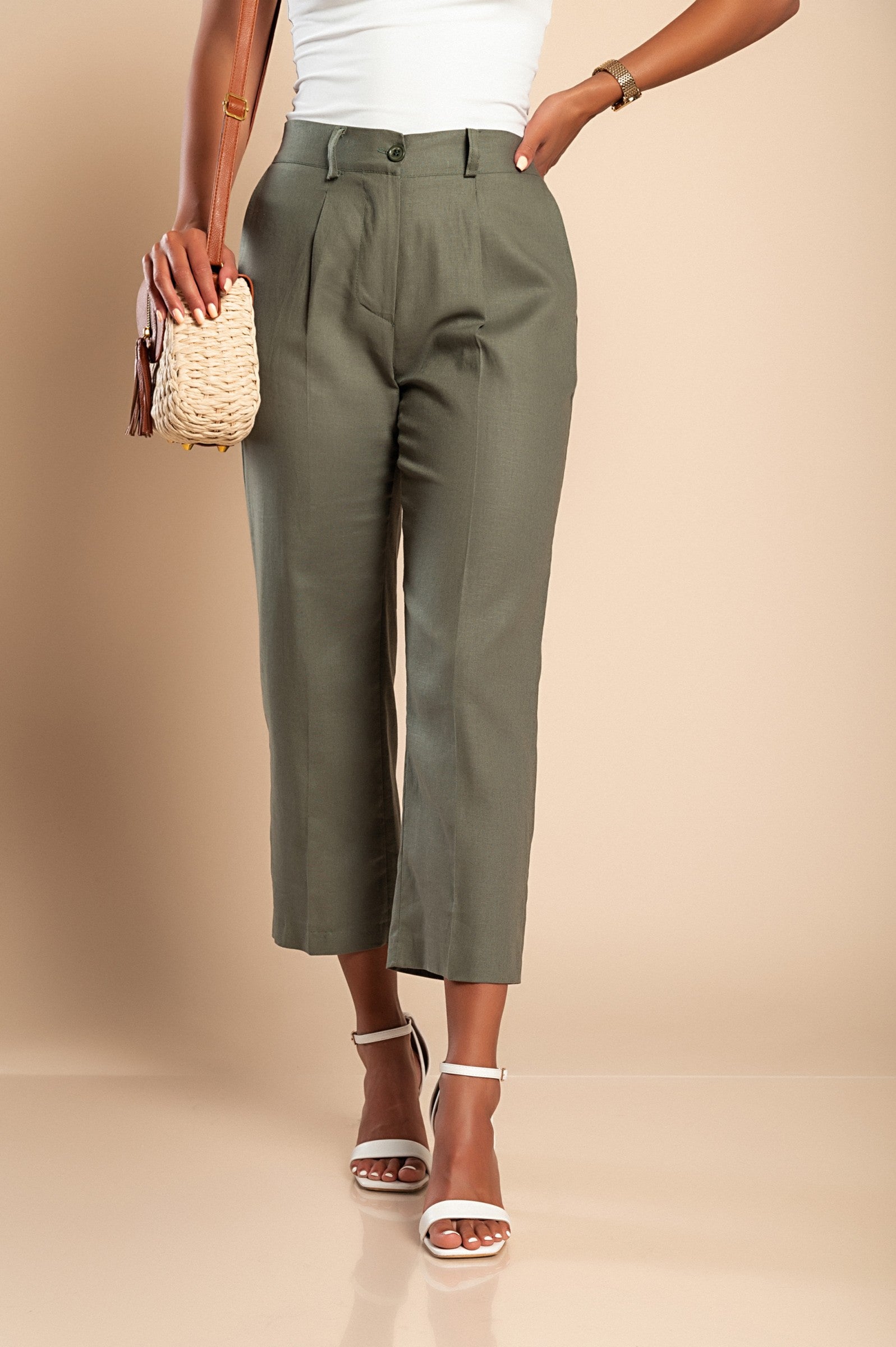 Elegant olive green linen trousers with straight cut and elasticated back, featuring side pockets, made in Italy.