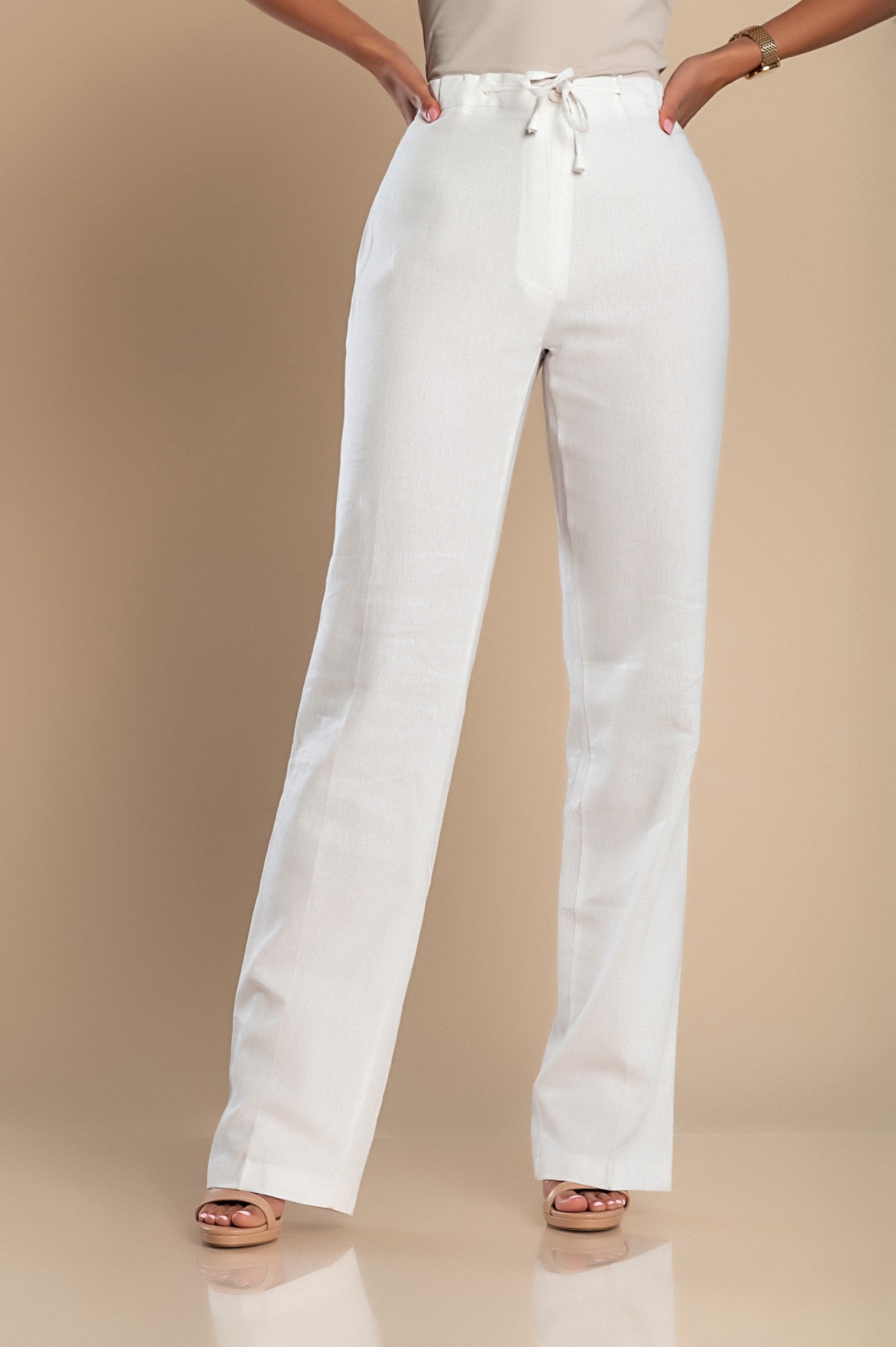 Elegant white linen trousers with a straight cut and drawstring waist, showcasing high-quality Italian craftsmanship.