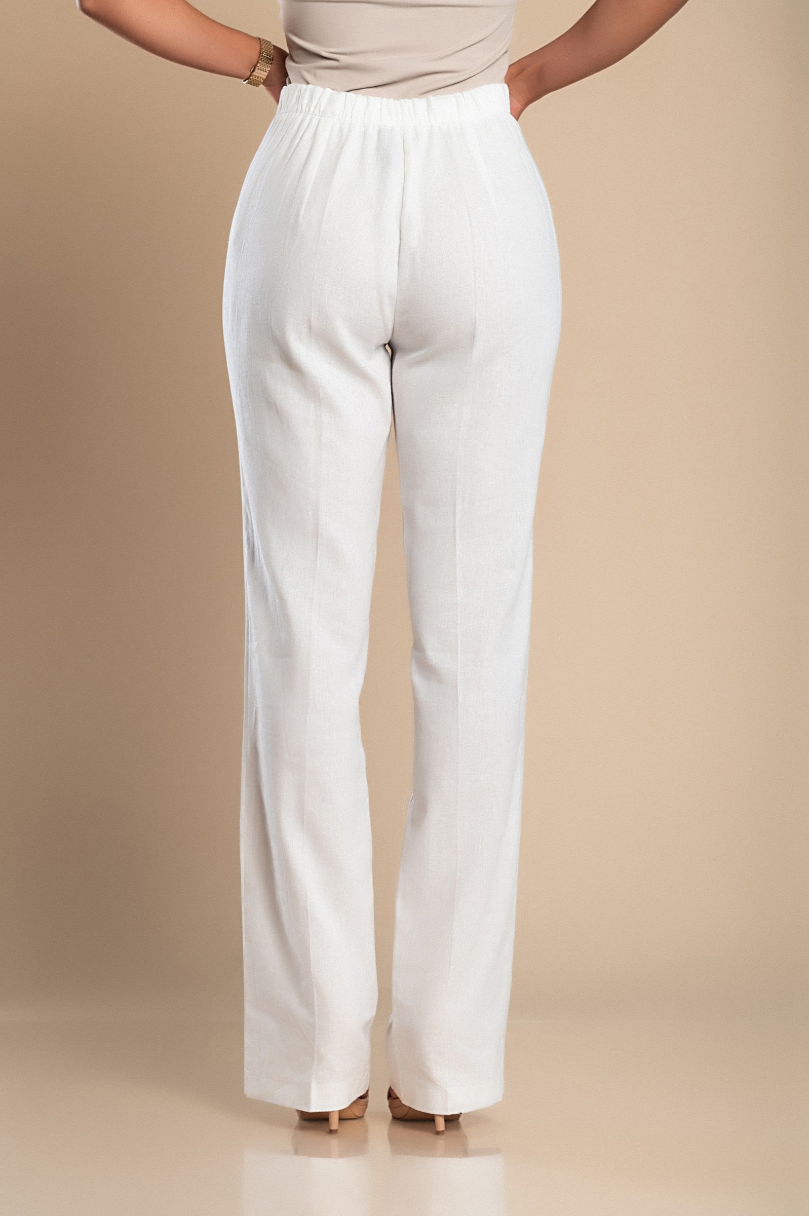 Elegant white linen trousers with a straight cut and drawstring waist, showcasing high-quality Italian craftsmanship.