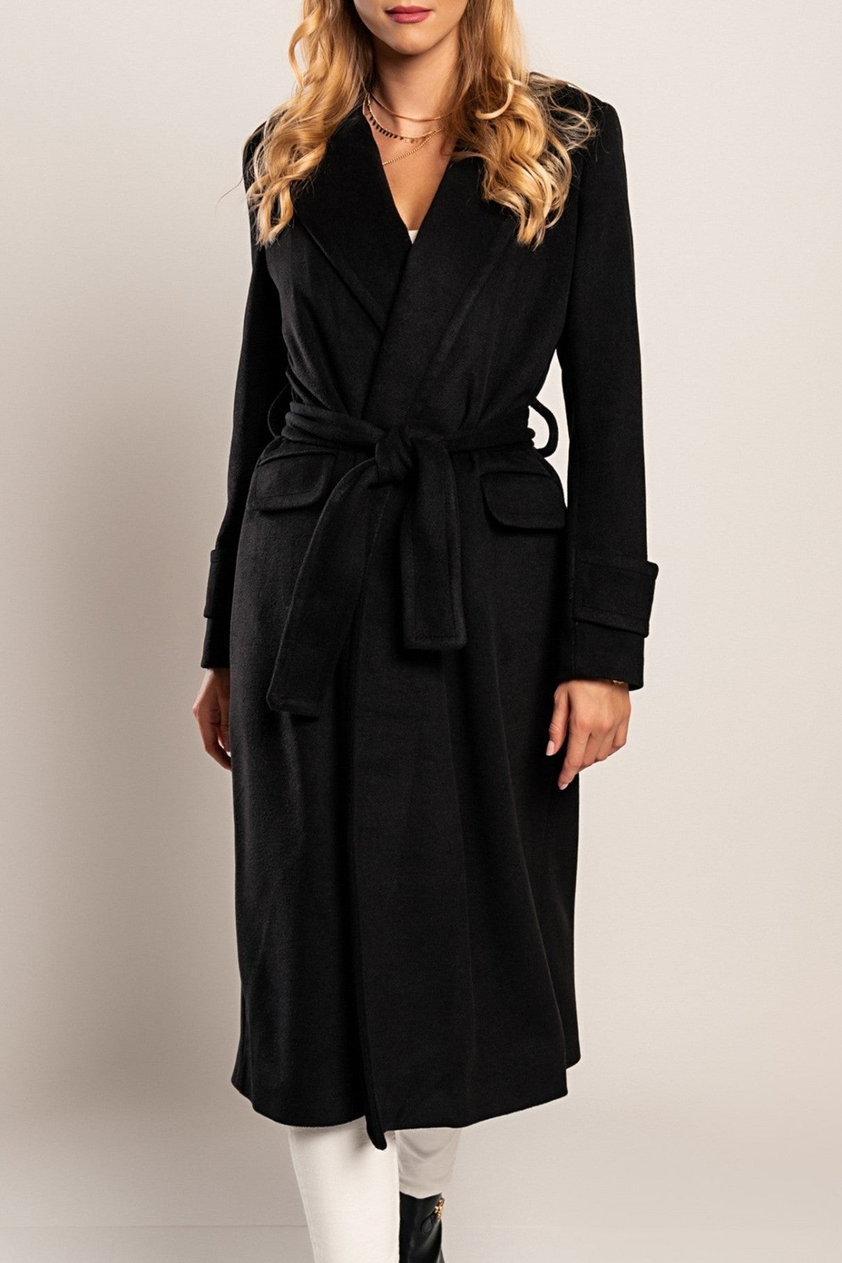 Elegant long black coat Canossa with classic collar and decorative belt, made of soft high-quality fabric.