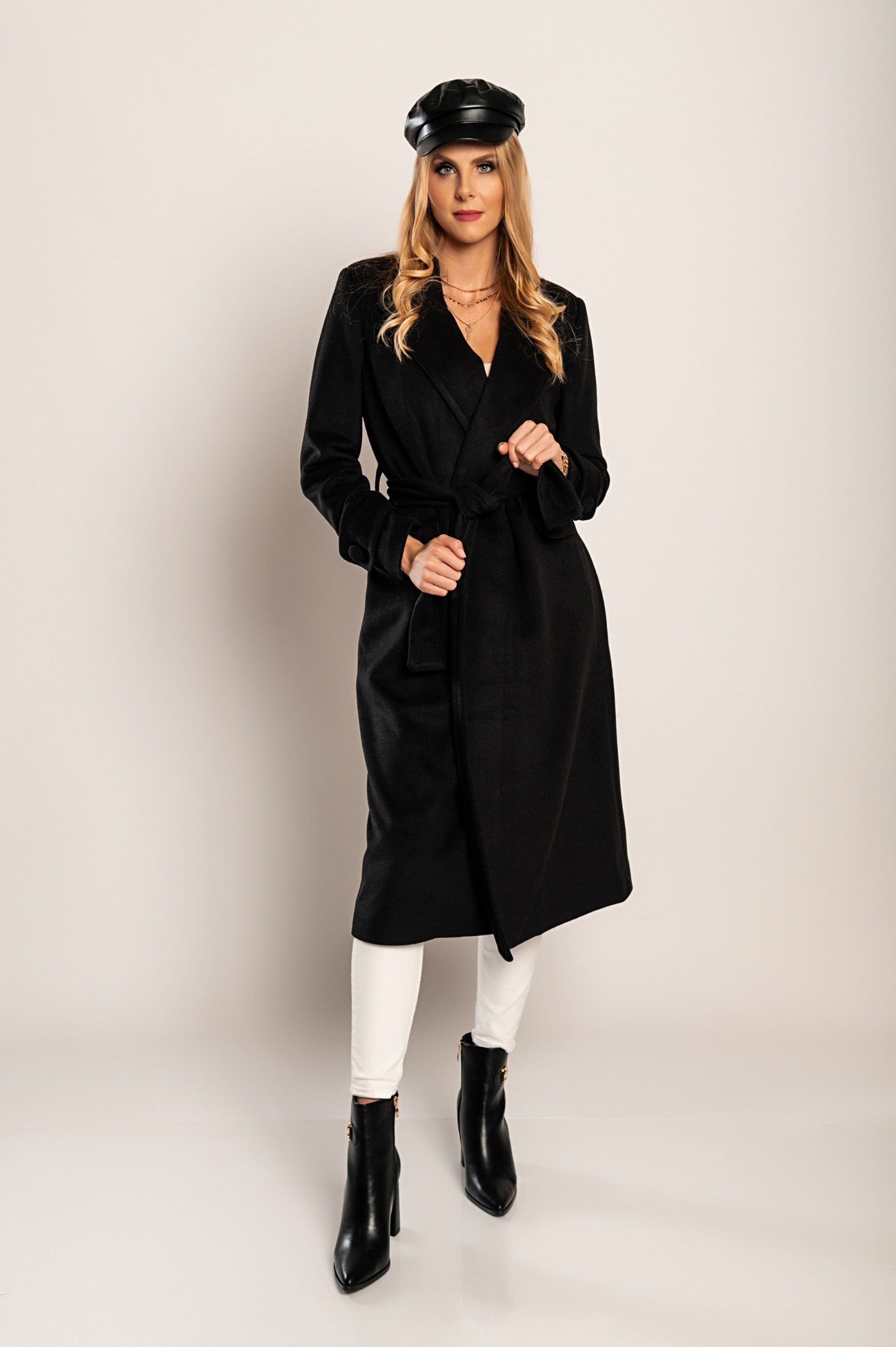 Elegant long black coat Canossa with classic collar and decorative belt, made of soft high-quality fabric.