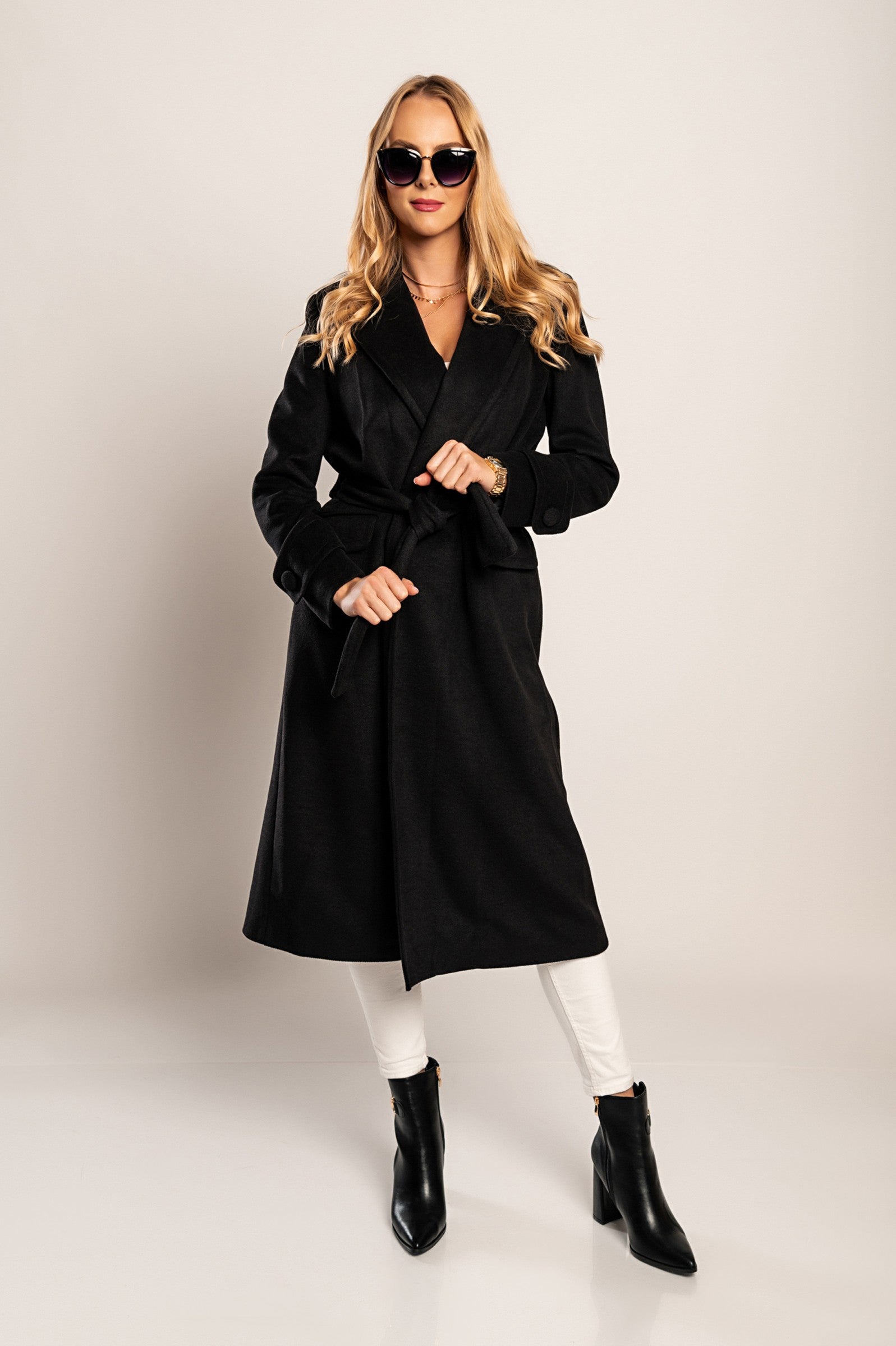 Elegant long black coat Canossa with classic collar and decorative belt, made of soft high-quality fabric.