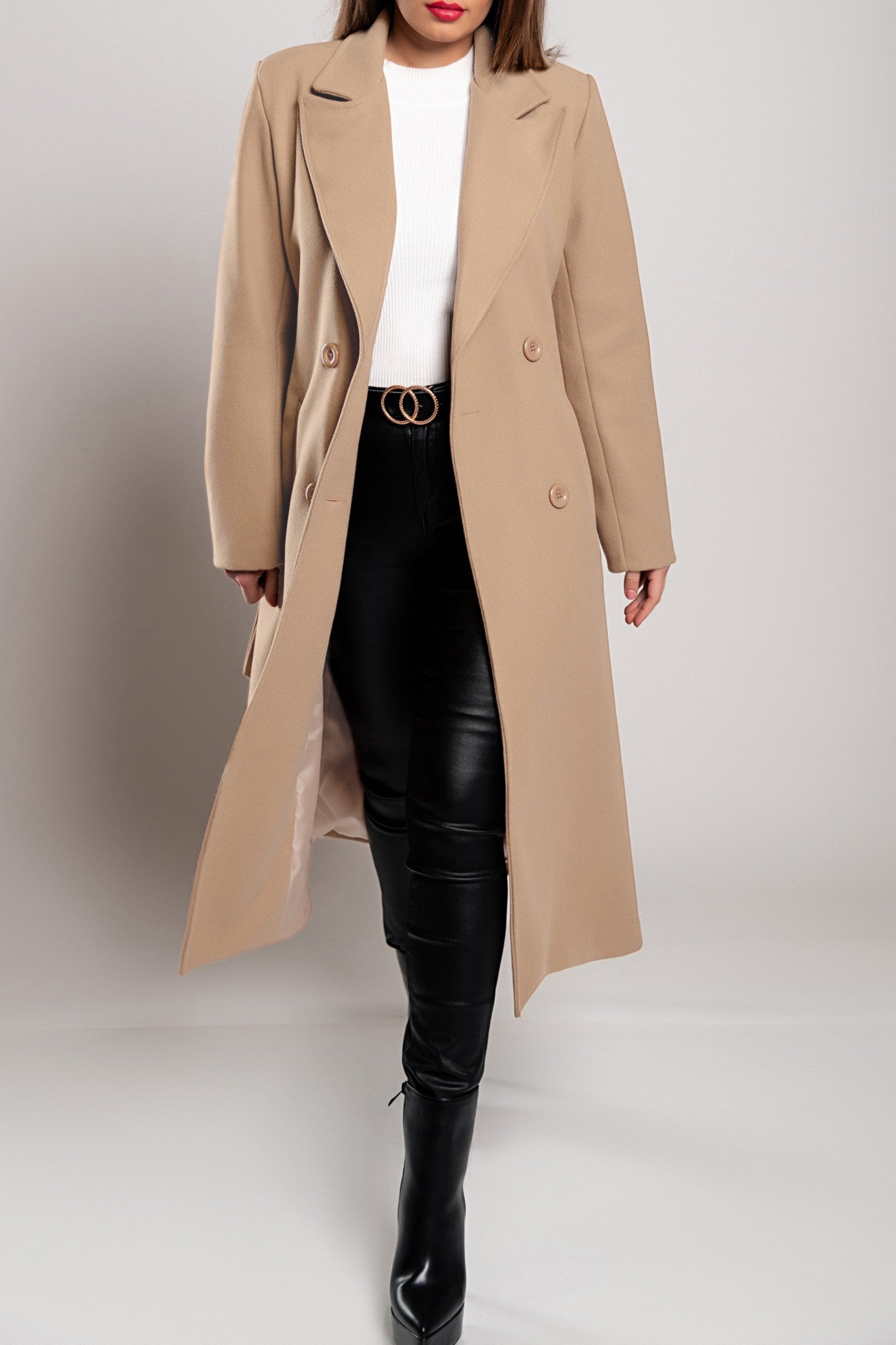 Elegant long beige coat with buttons and decorative belt, showcasing classic collar and long sleeves.