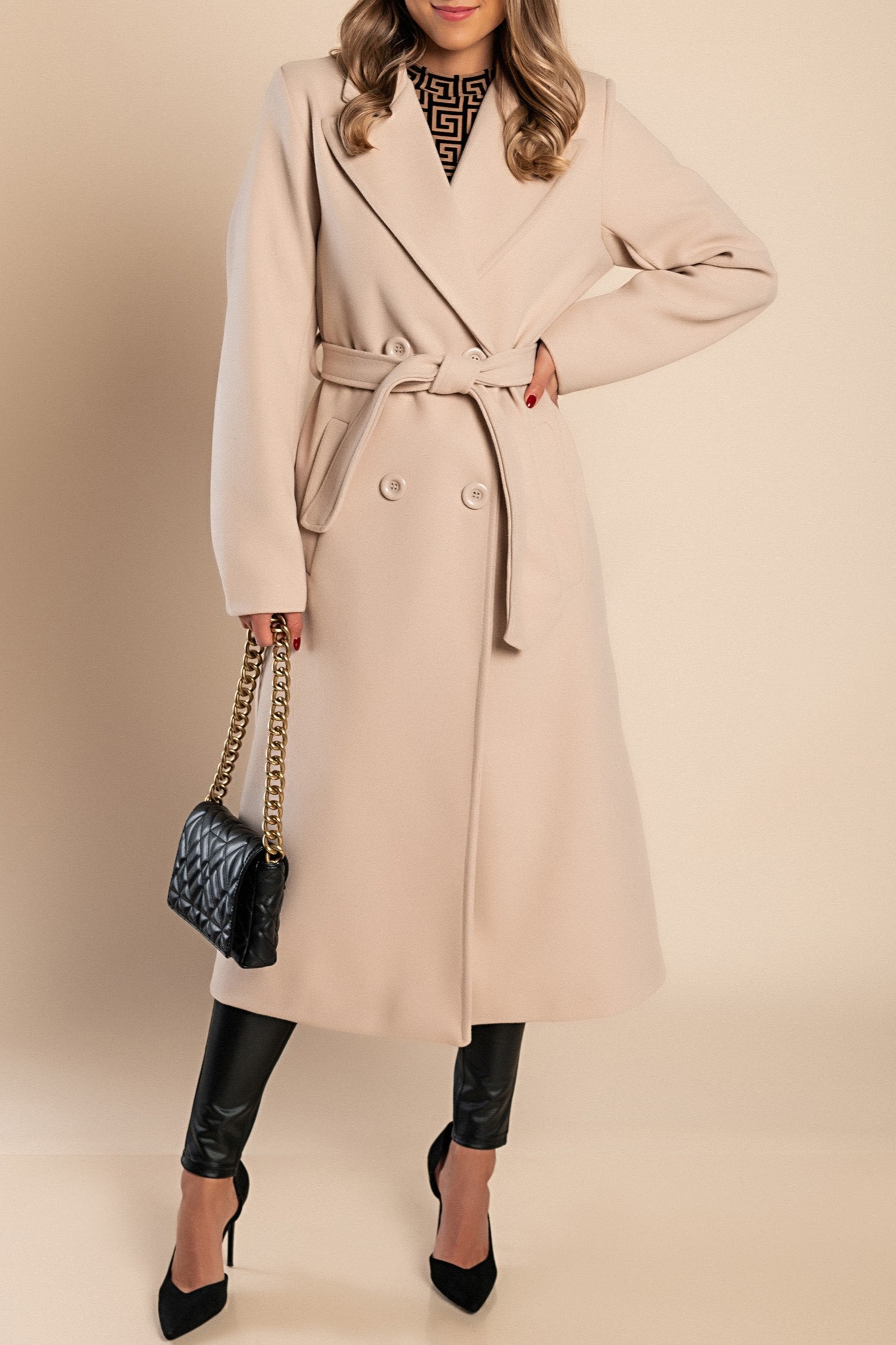 Elegant long beige coat with buttons, featuring a classic collar and decorative belt, made from high-quality soft fabric.