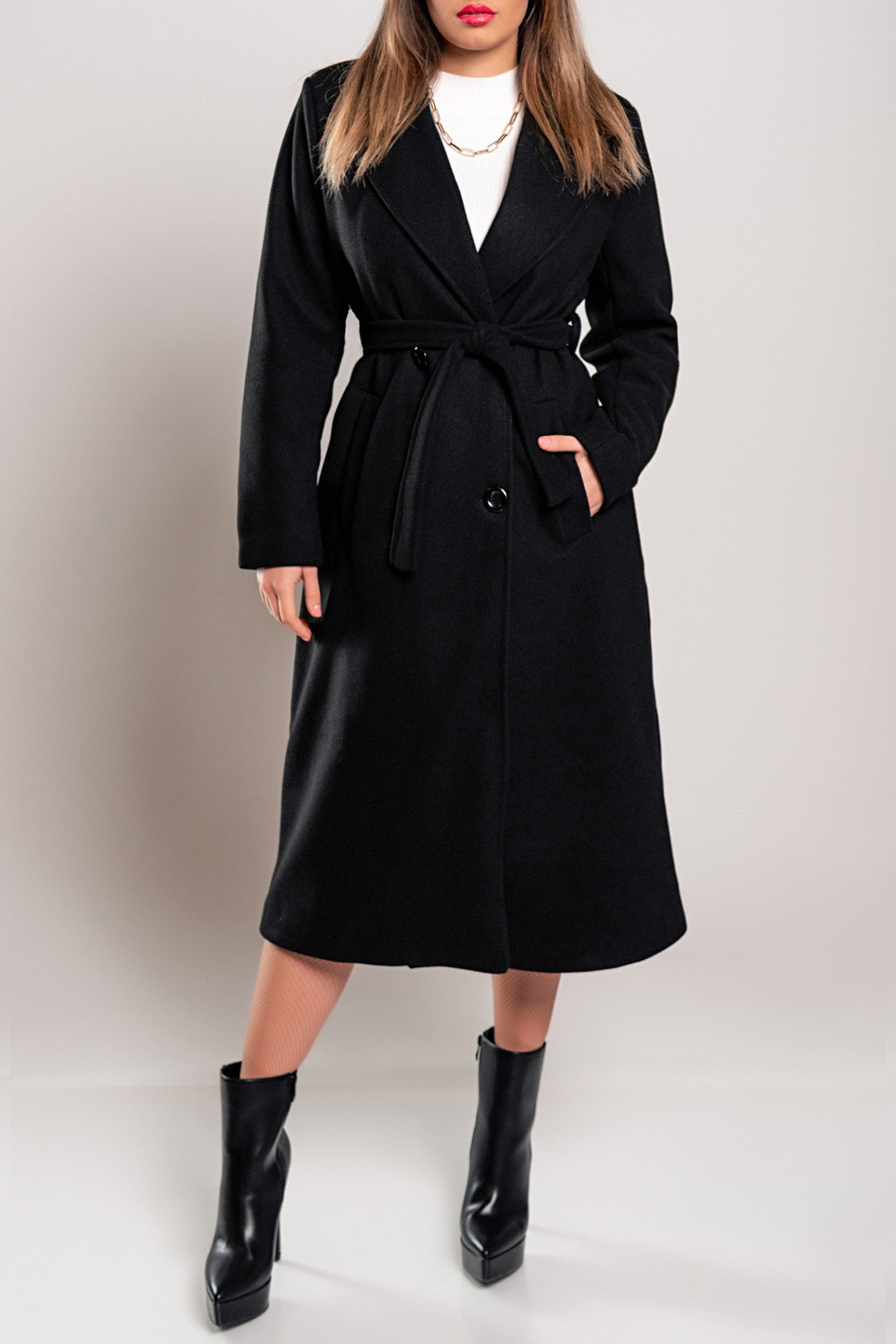 Elegant black long coat with buttons and decorative belt, showcasing classic collar and long sleeves.