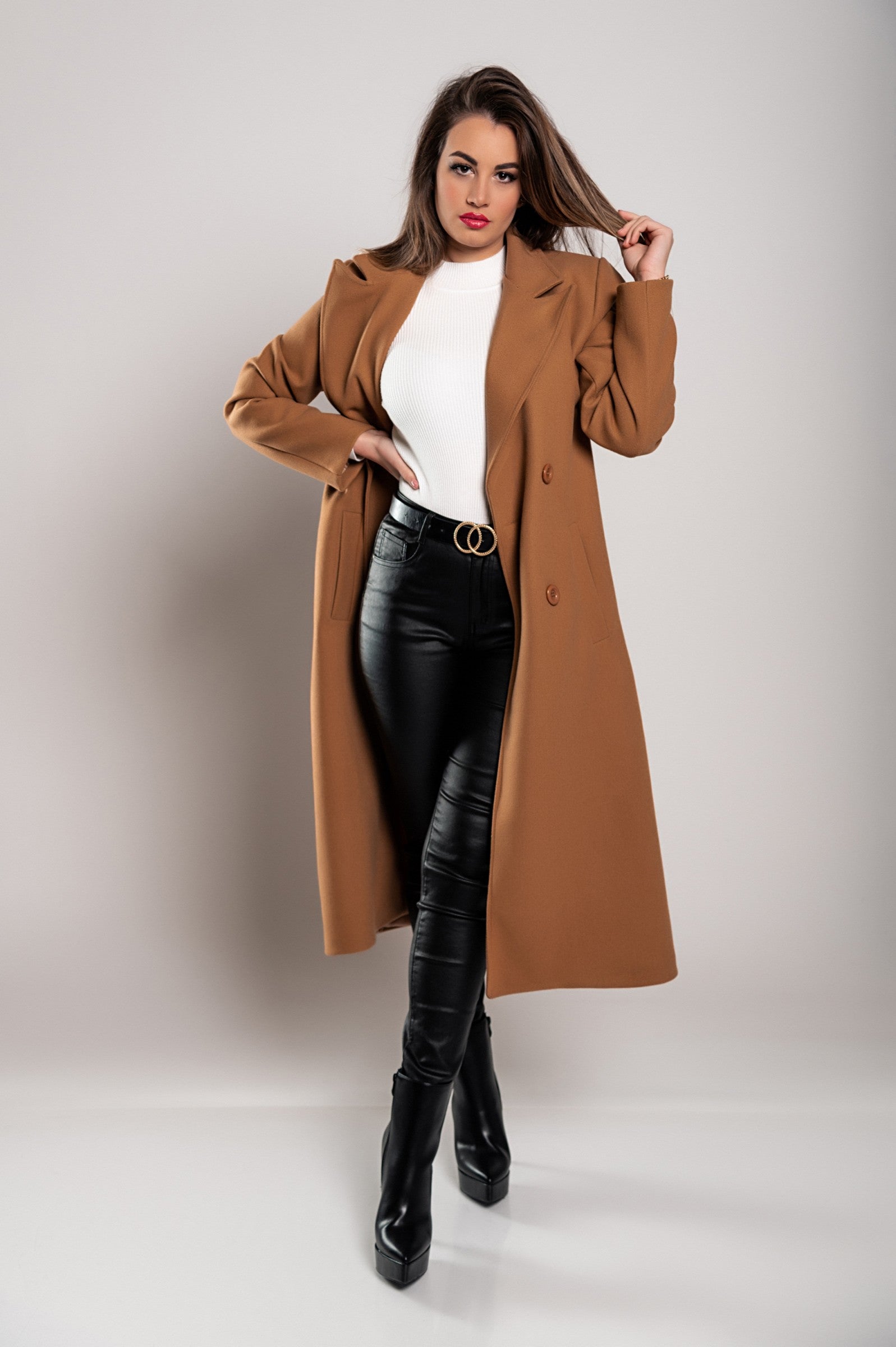 Elegant camel long coat with buttons, featuring a classic collar and decorative belt, perfect for stylish occasions.