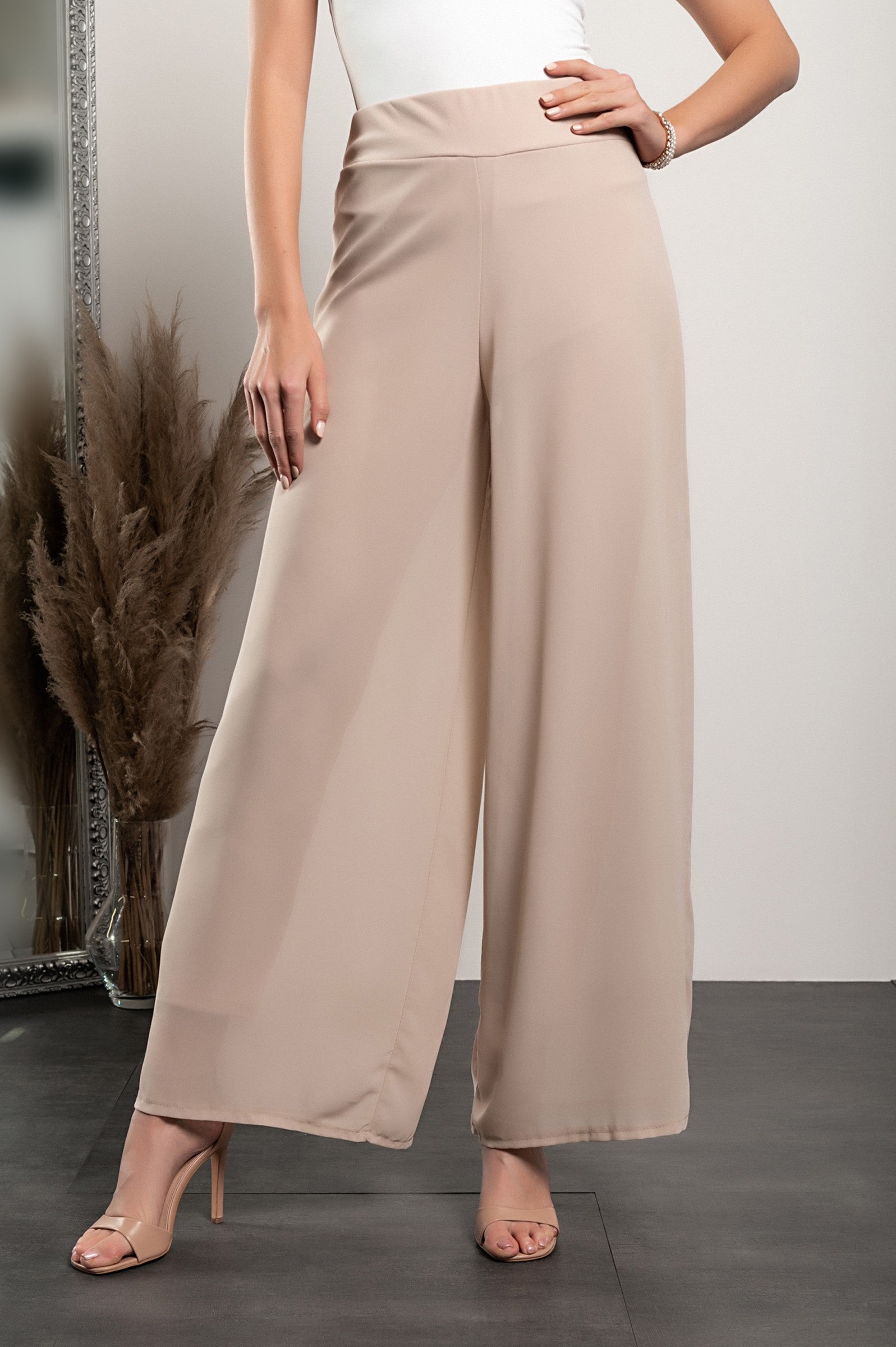 Elegant long beige pants Verona with high waist and sheer top layer, showcasing a loose fit and high-quality fabric.