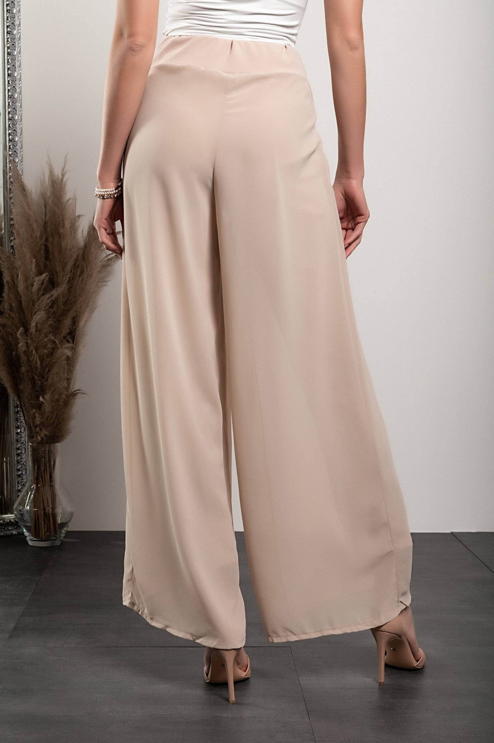 Elegant long beige pants Verona with high waist and sheer top layer, showcasing a loose fit and high-quality fabric.