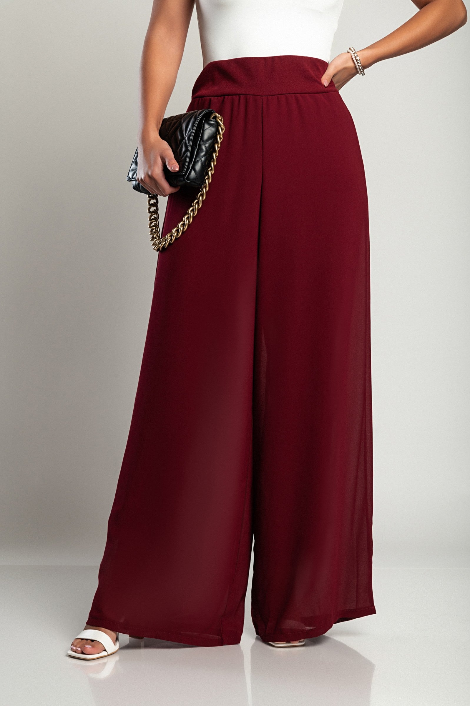 Elegant long pants Verona in burgundy, featuring a high waist and sheer top layer, made from soft and compact fabric.