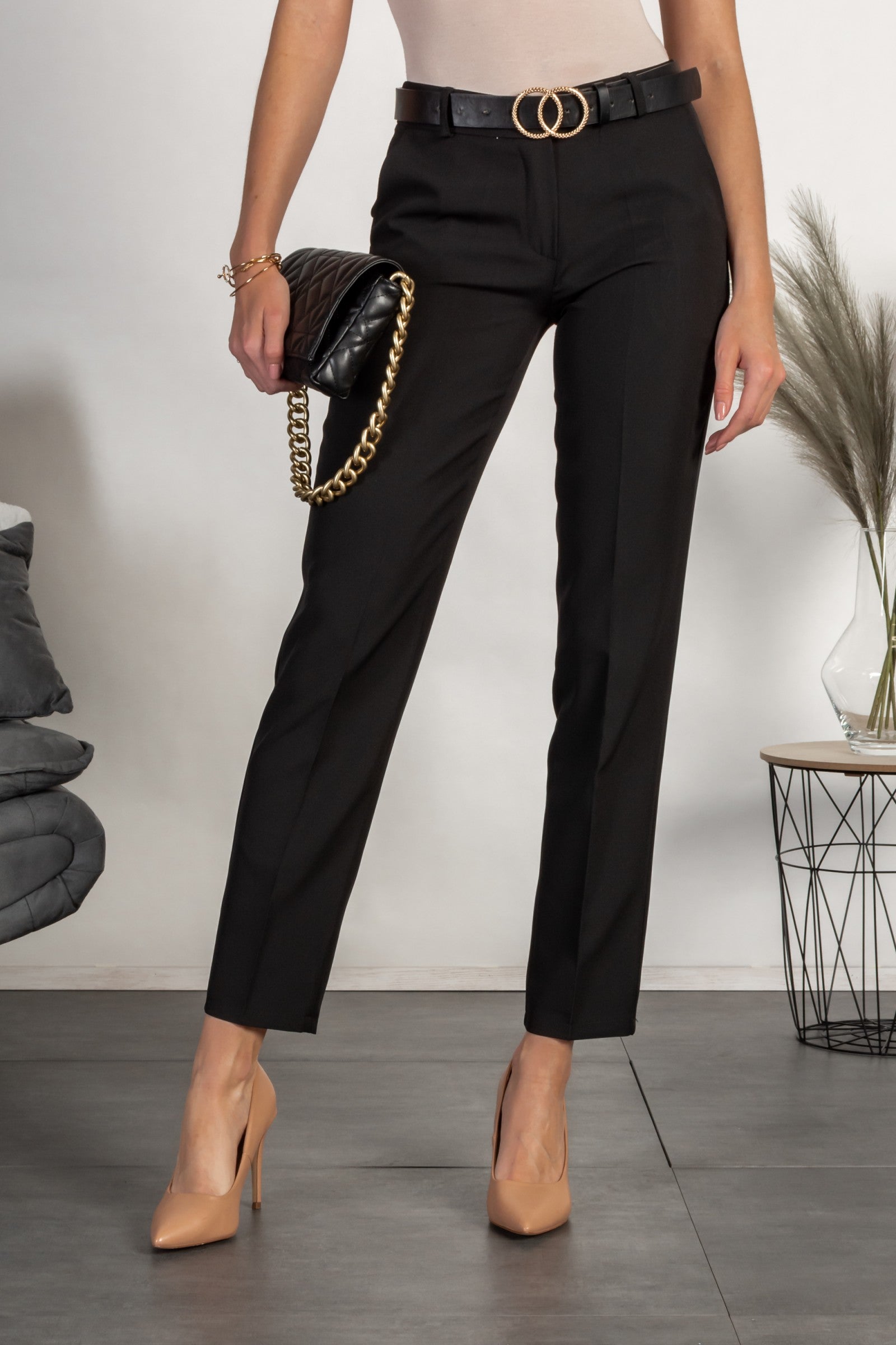 Elegant black long pants with wide trousers and decorative pockets, designed for comfort and style.