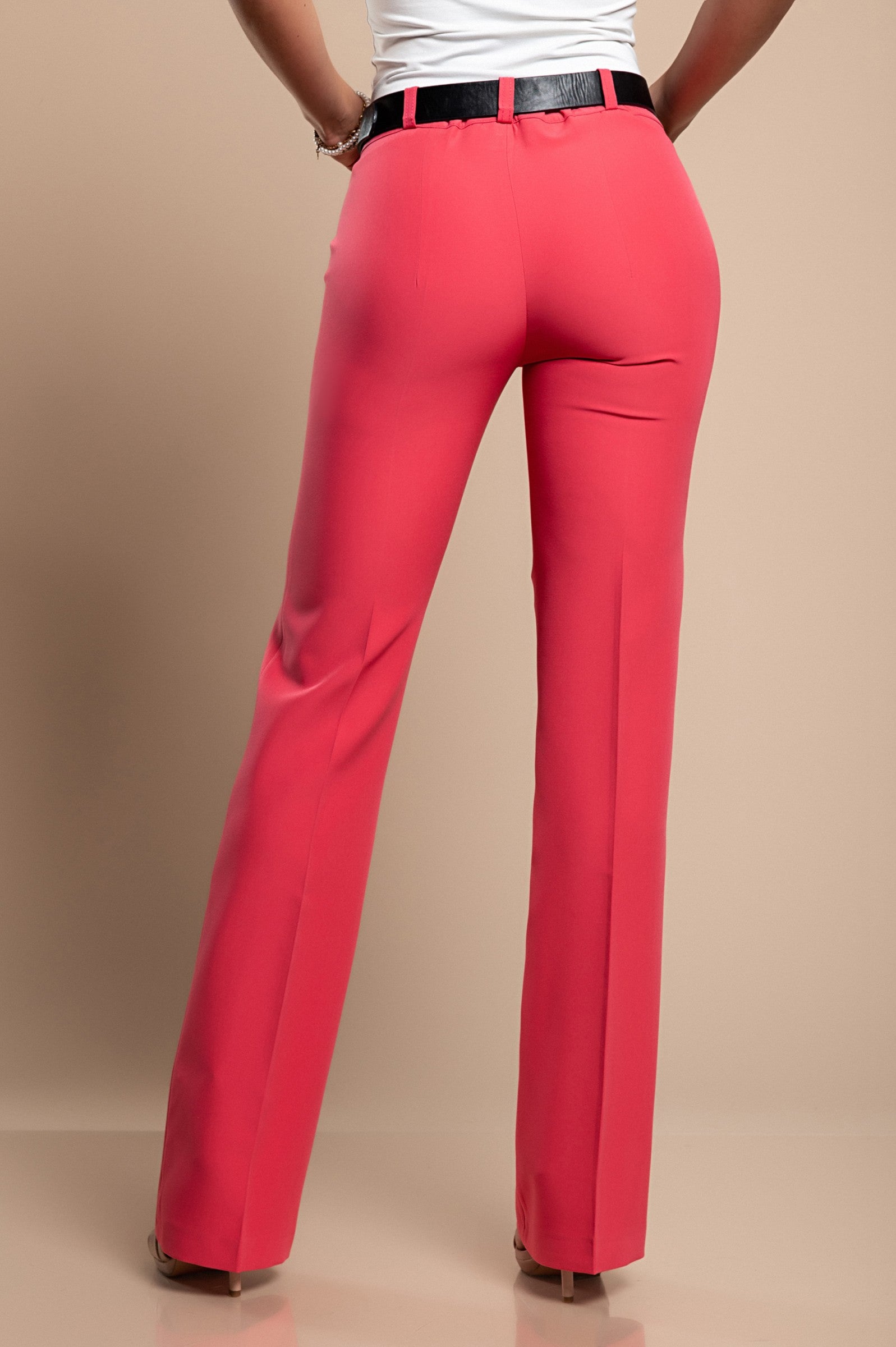 Elegant long straight-leg trousers in coral color, showcasing a mid-waist design with zip and button closure.