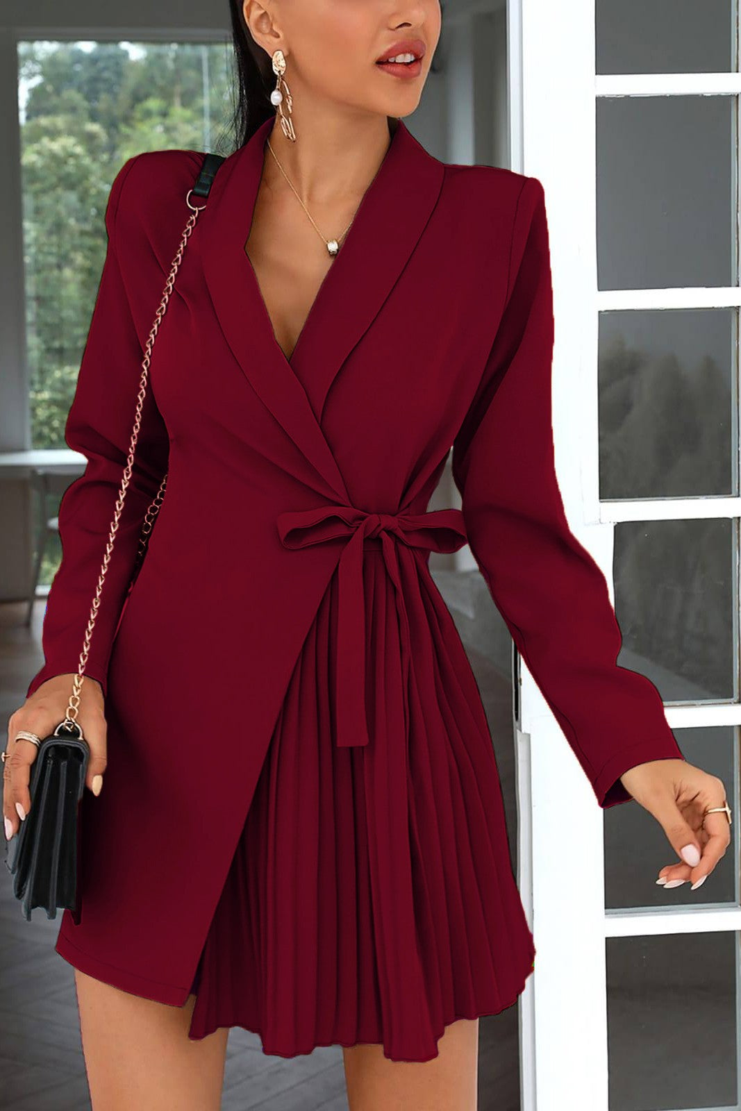 Elegant long-sleeved mini dress featuring a deep 'V' neckline, classic collar, and pleated skirt, perfect for various occasions.