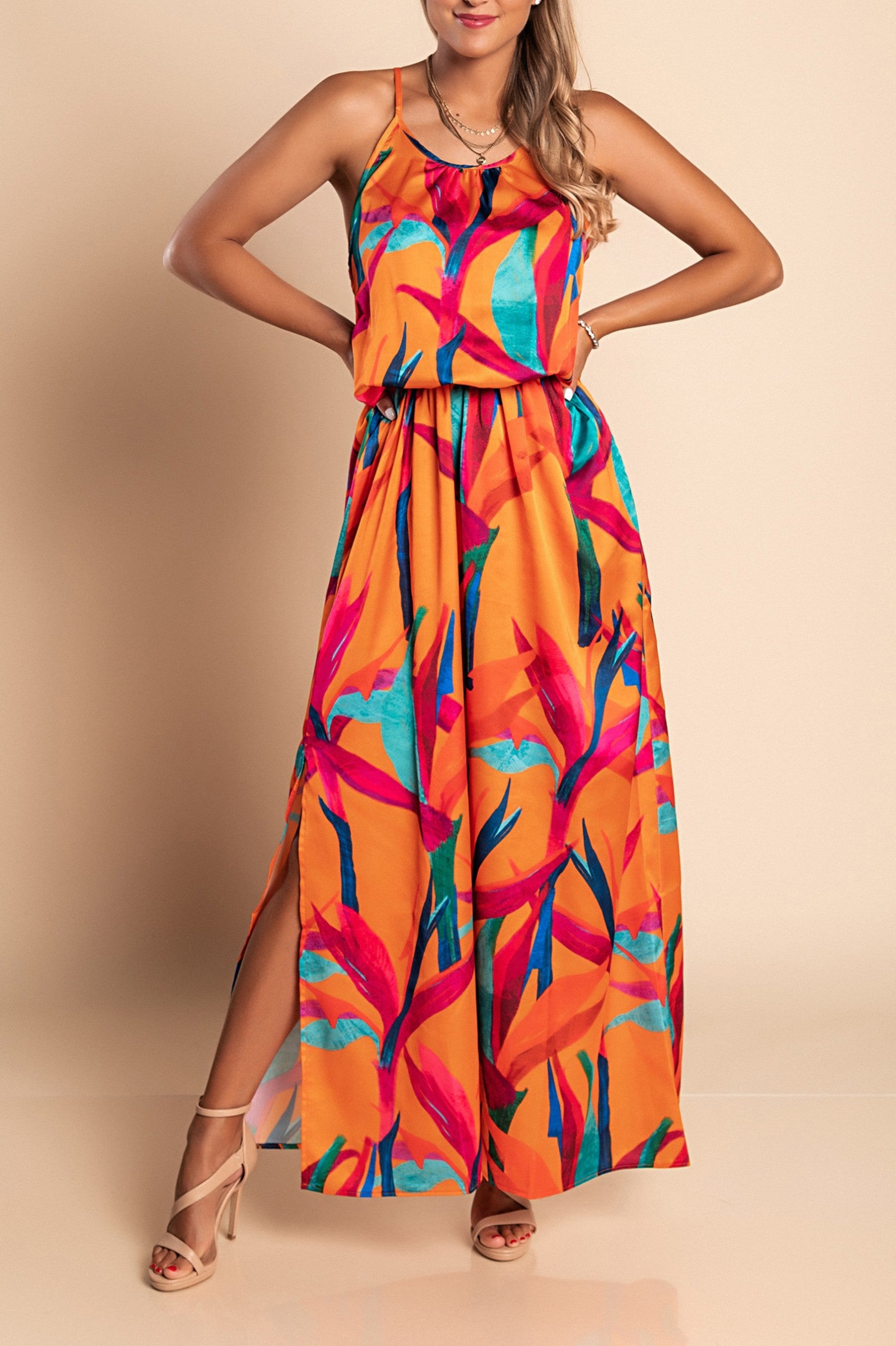 Elegant orange maxi dress with print, featuring a round neckline and elasticated waist, made from high-quality imitation satin.