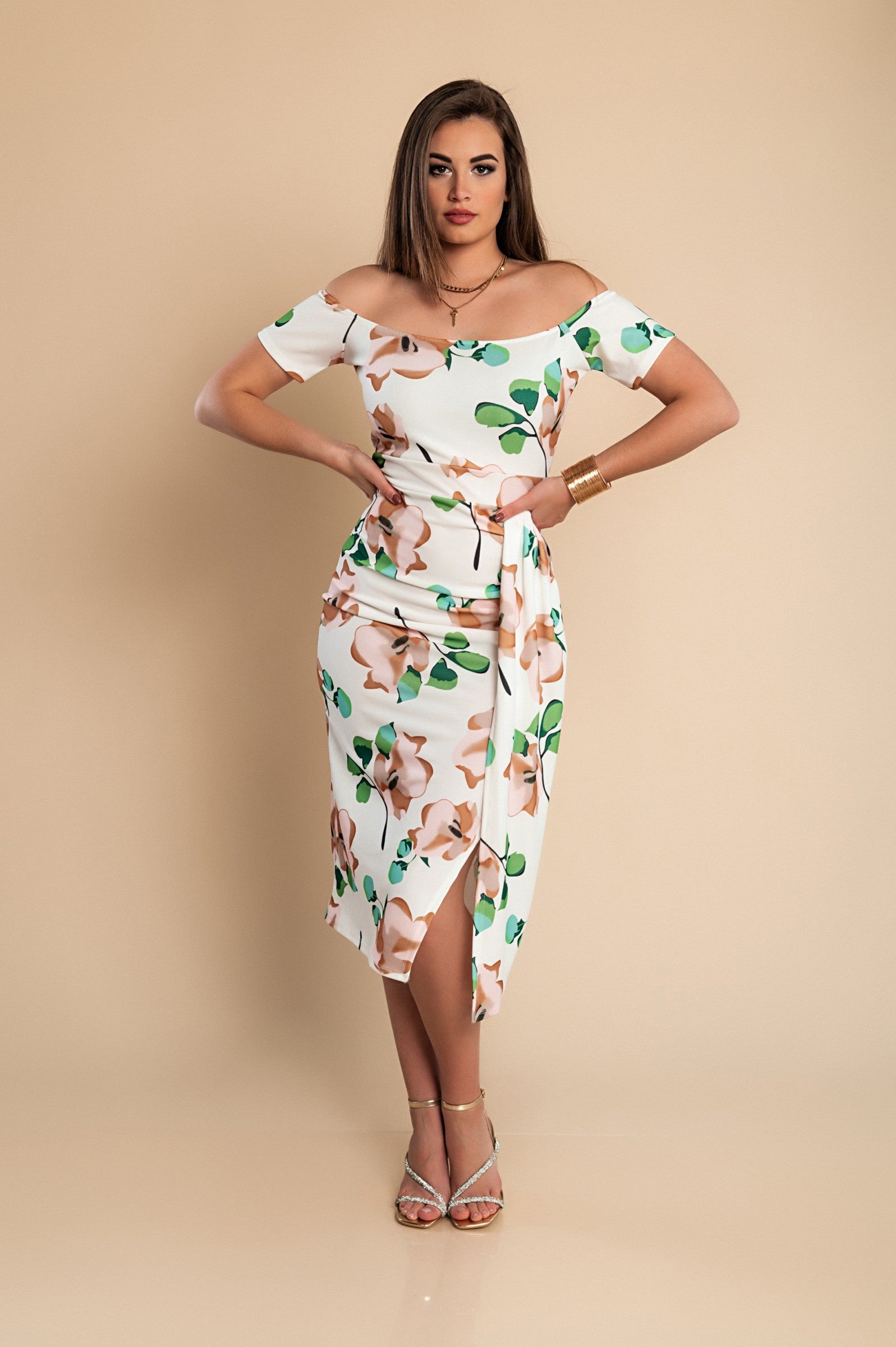 Elegant green midi dress with floral print, featuring a straight neckline and short sleeves, perfect for various occasions.