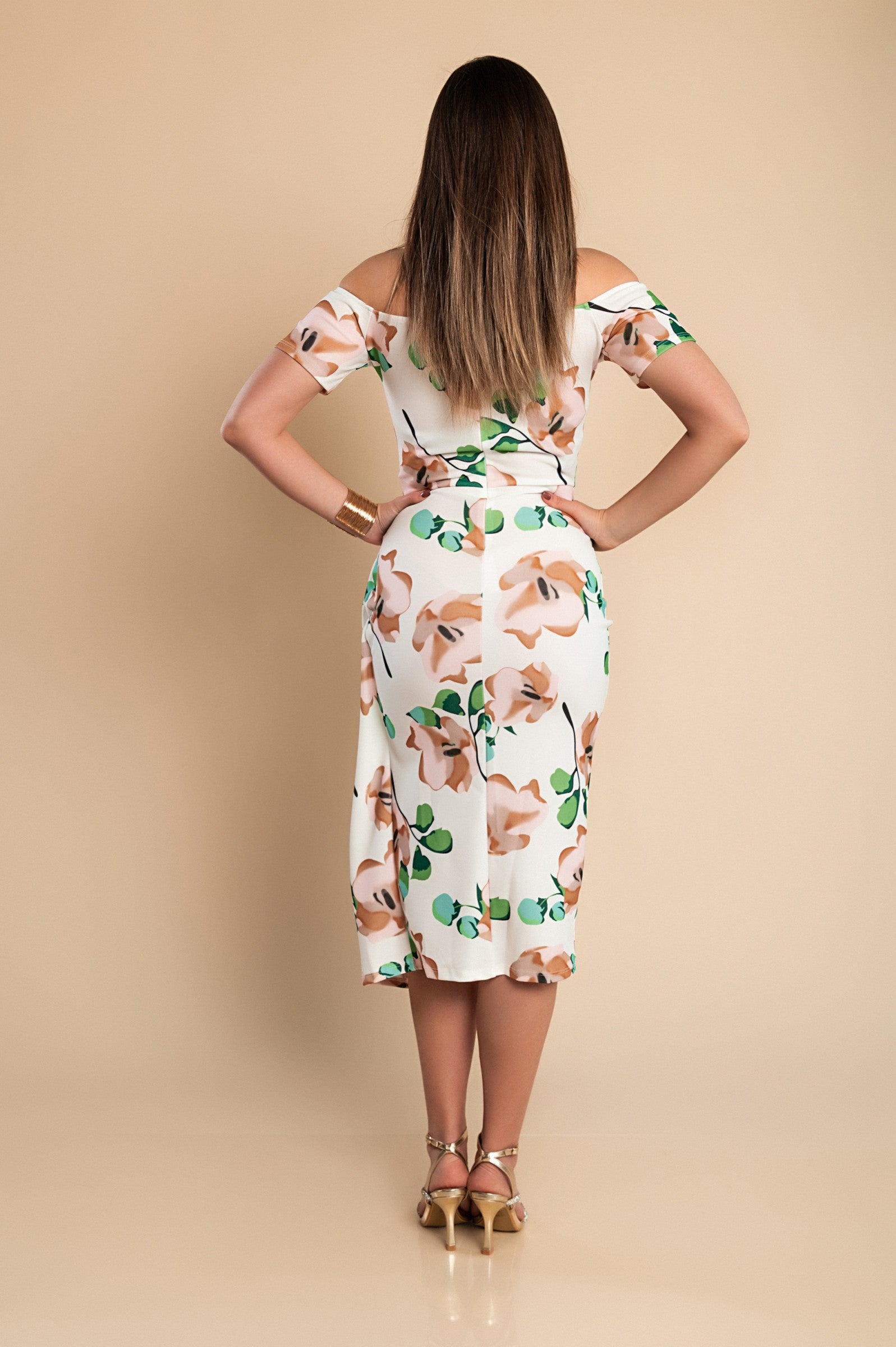 Elegant green midi dress with floral print, featuring a straight neckline and short sleeves, perfect for various occasions.