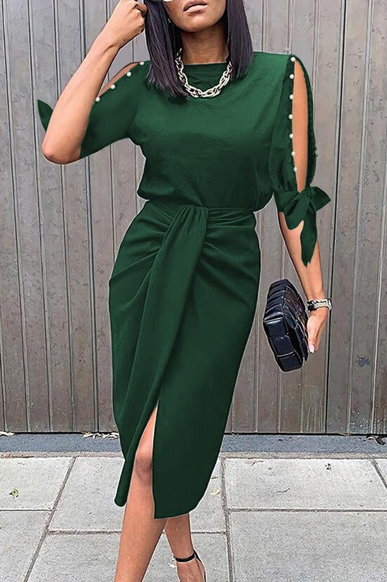 Elegant green midi dress with pearl details and 3/4 sleeves, featuring a round neckline and high-waisted gathered skirt.