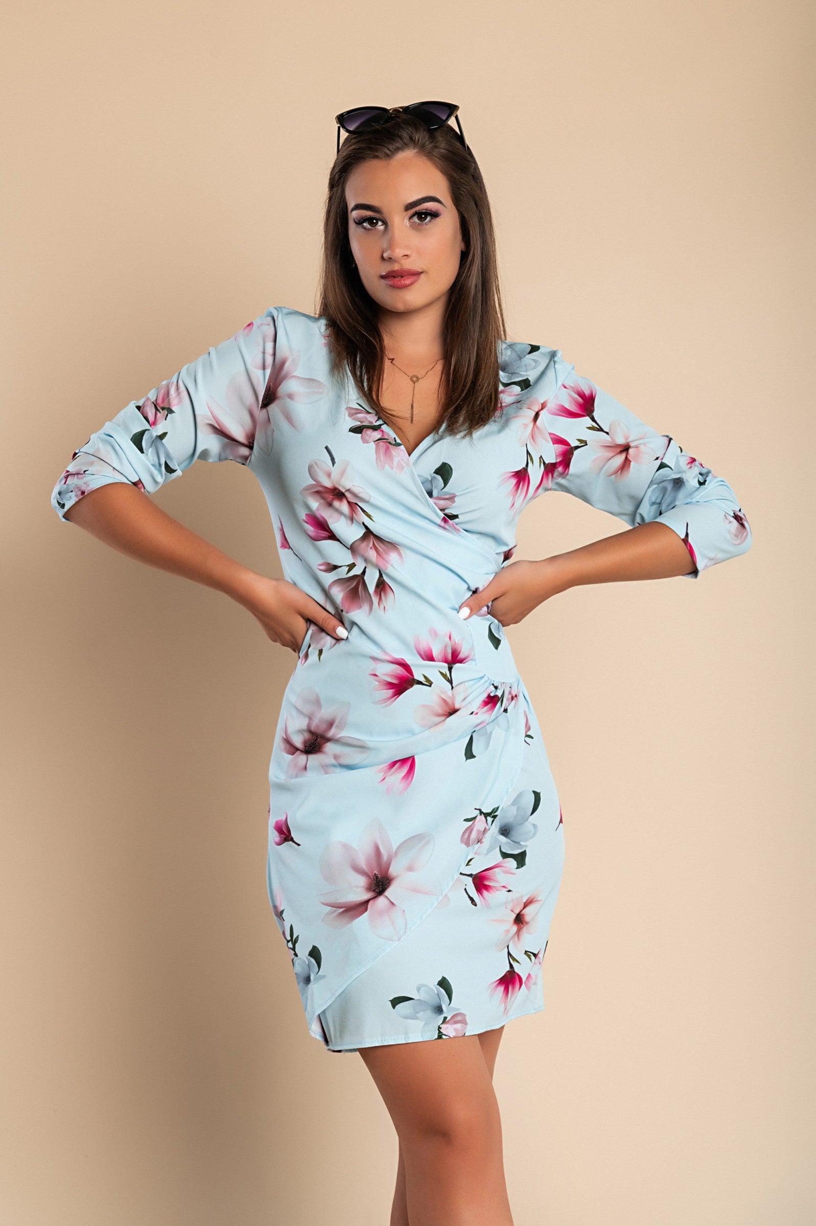 Elegant light blue midi dress with flower print and ruffles, featuring a deep V neckline and 3/4 sleeves, perfect for various occasions.