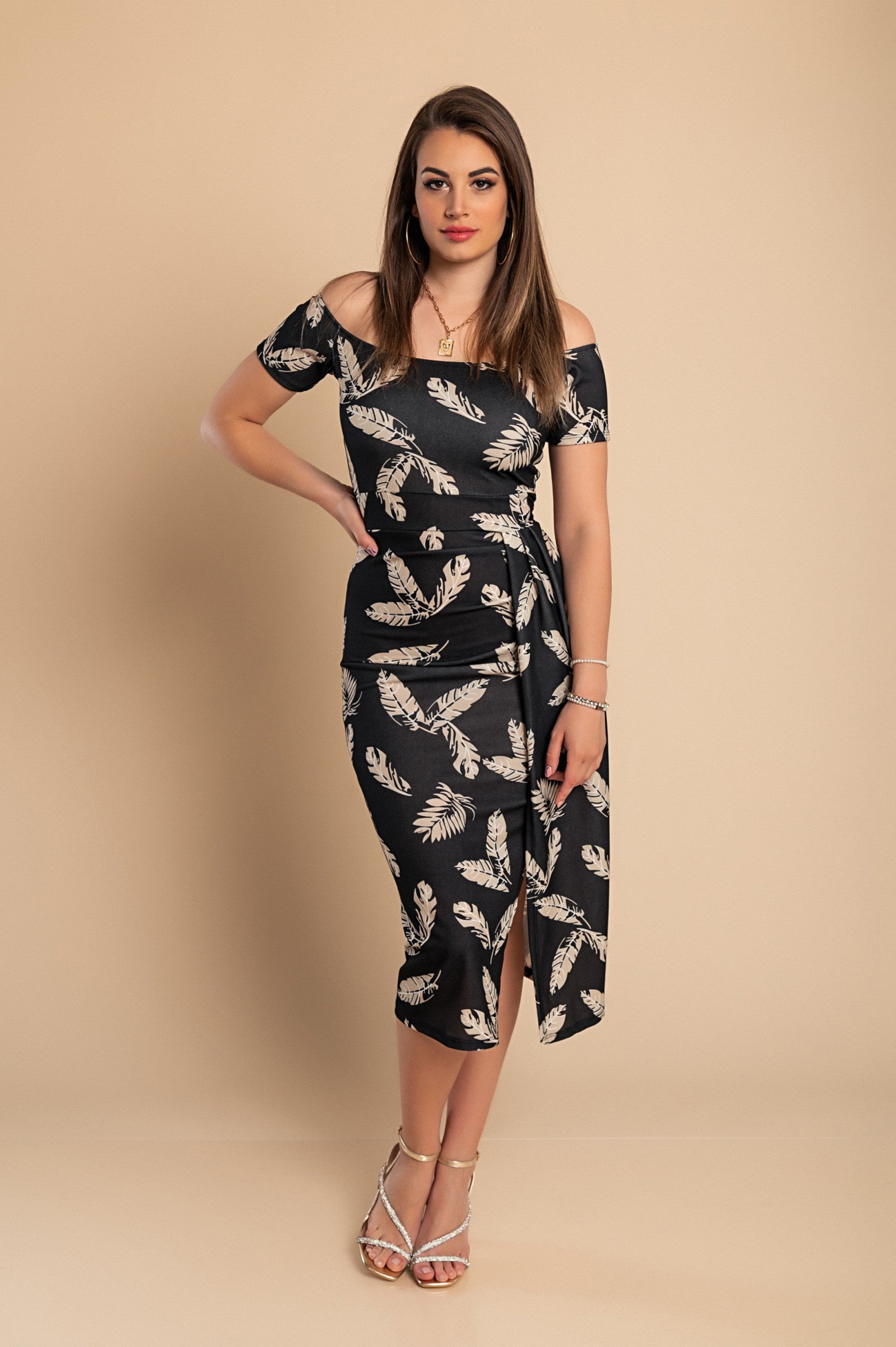 Elegant black midi dress with print featuring a straight neckline, short sleeves, and a wrap skirt design, perfect for various occasions.