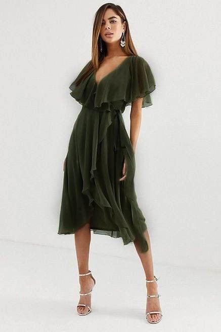 Elegant midi dress in olive color featuring a deep V-neckline, ruffle detail, and asymmetrical wrap skirt, perfect for various occasions.