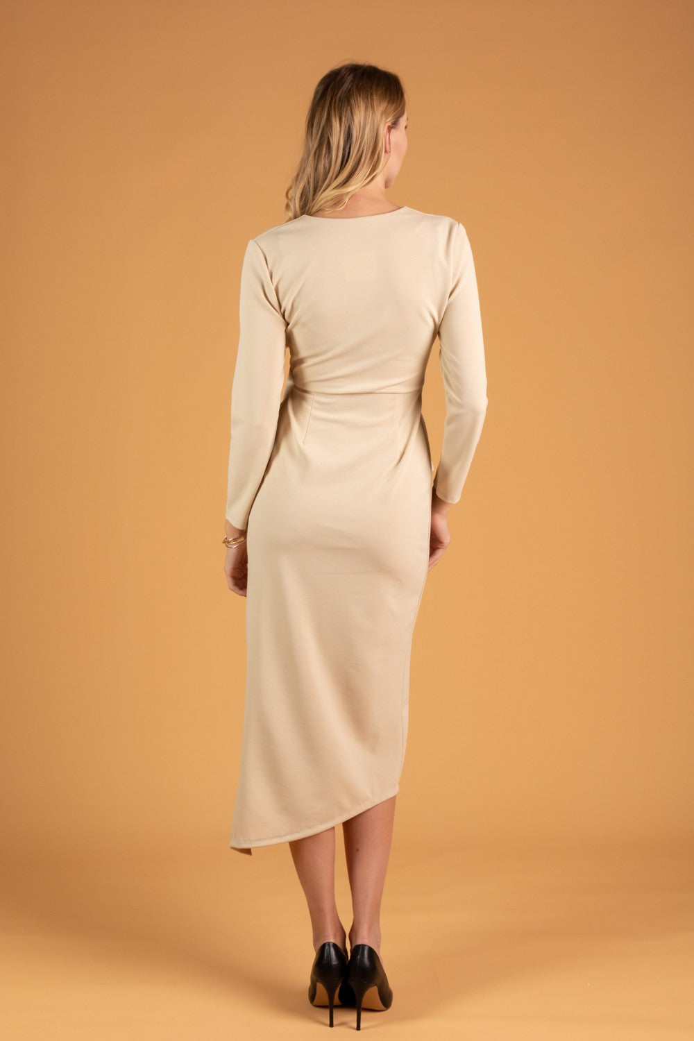 Elegant midi dress featuring ruffles, 3/4 sleeves, and an ankle-length skirt, perfect for various occasions.