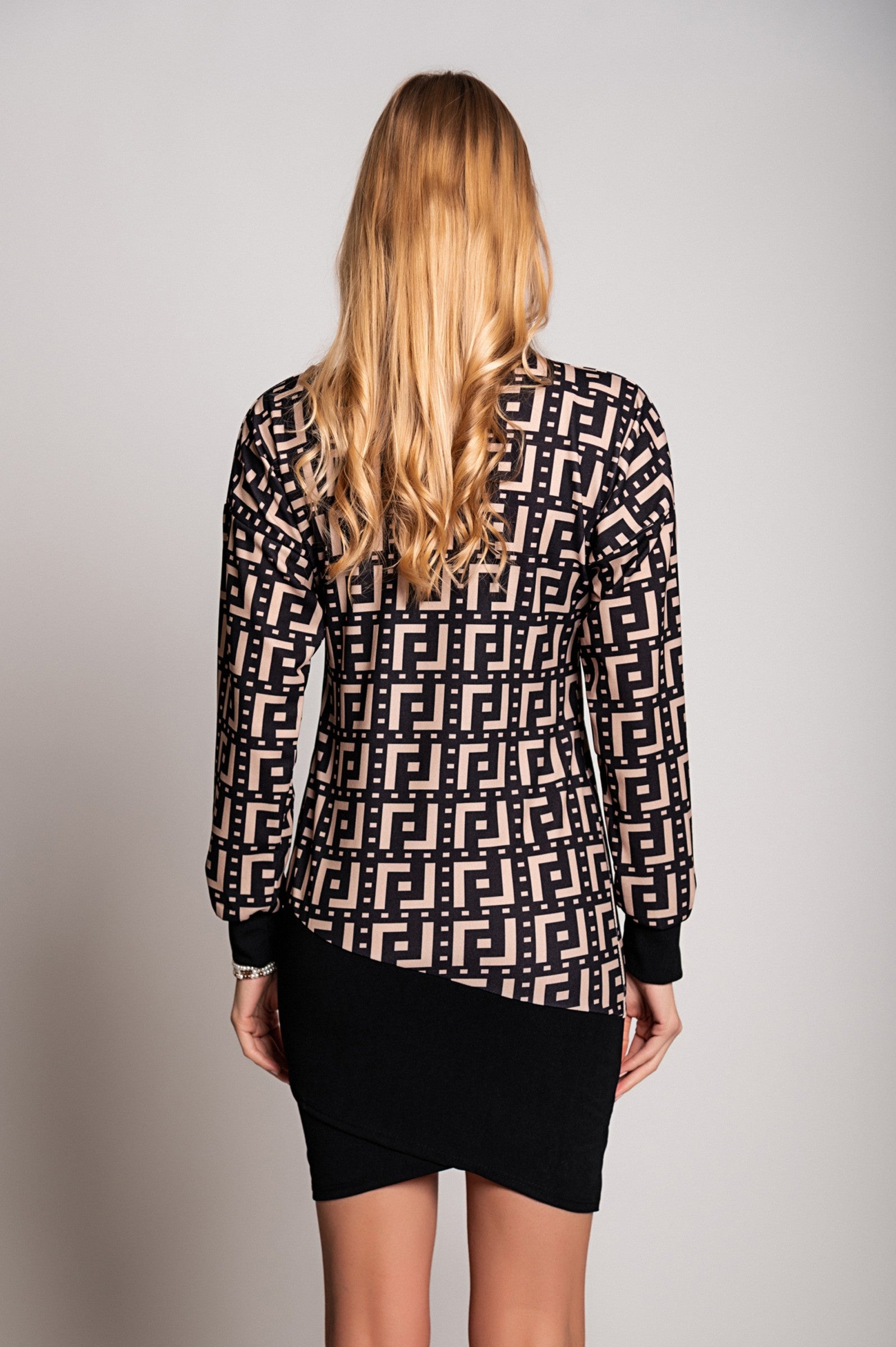 Elegant mini dress Trina featuring a geometric print in black and beige, high neck, long sleeves, and asymmetrical fitted skirt.