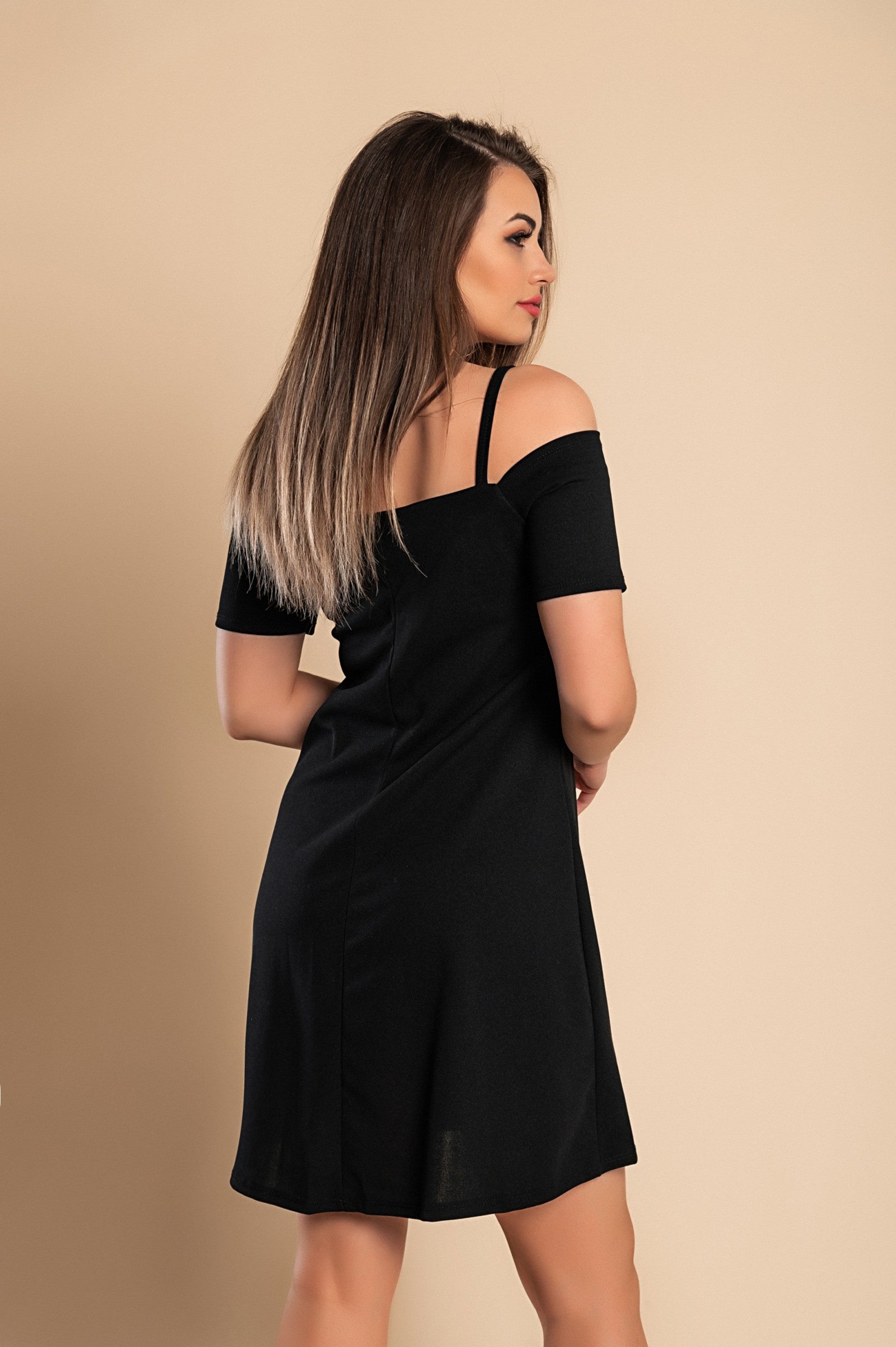 Elegant mini dress featuring short sleeves, open shoulders, and suspenders, made from soft fabric, reaching mid-thigh.