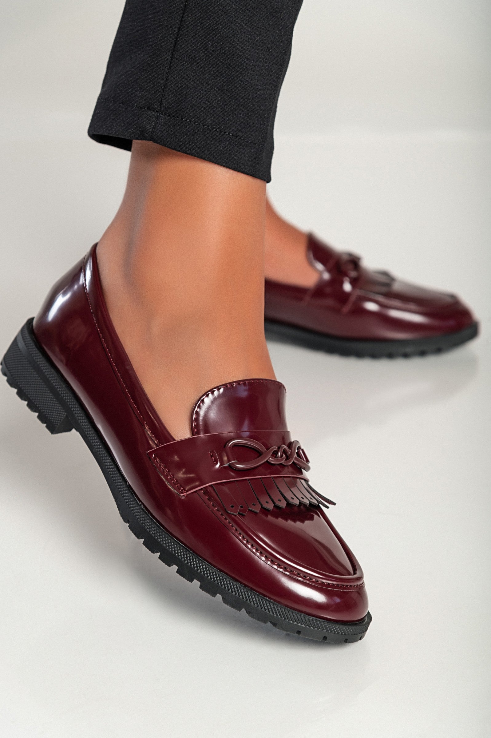 Elegant burgundy moccasins G5018 with decorative detail and flat sole, showcasing quality craftsmanship.