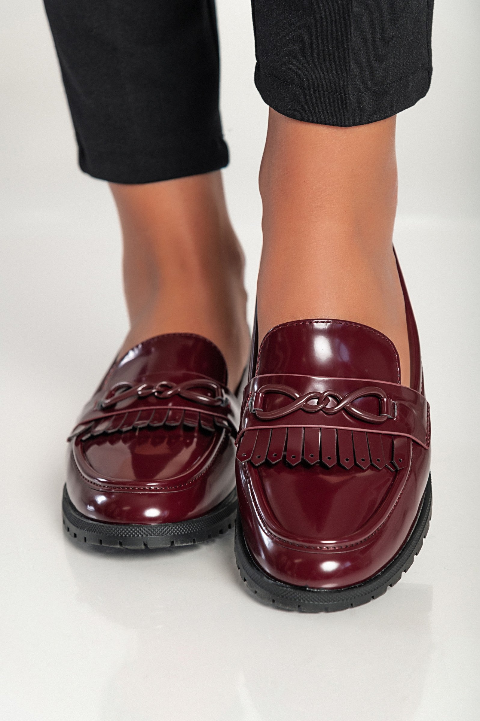 Elegant burgundy moccasins G5018 with decorative detail and flat sole, showcasing quality craftsmanship.