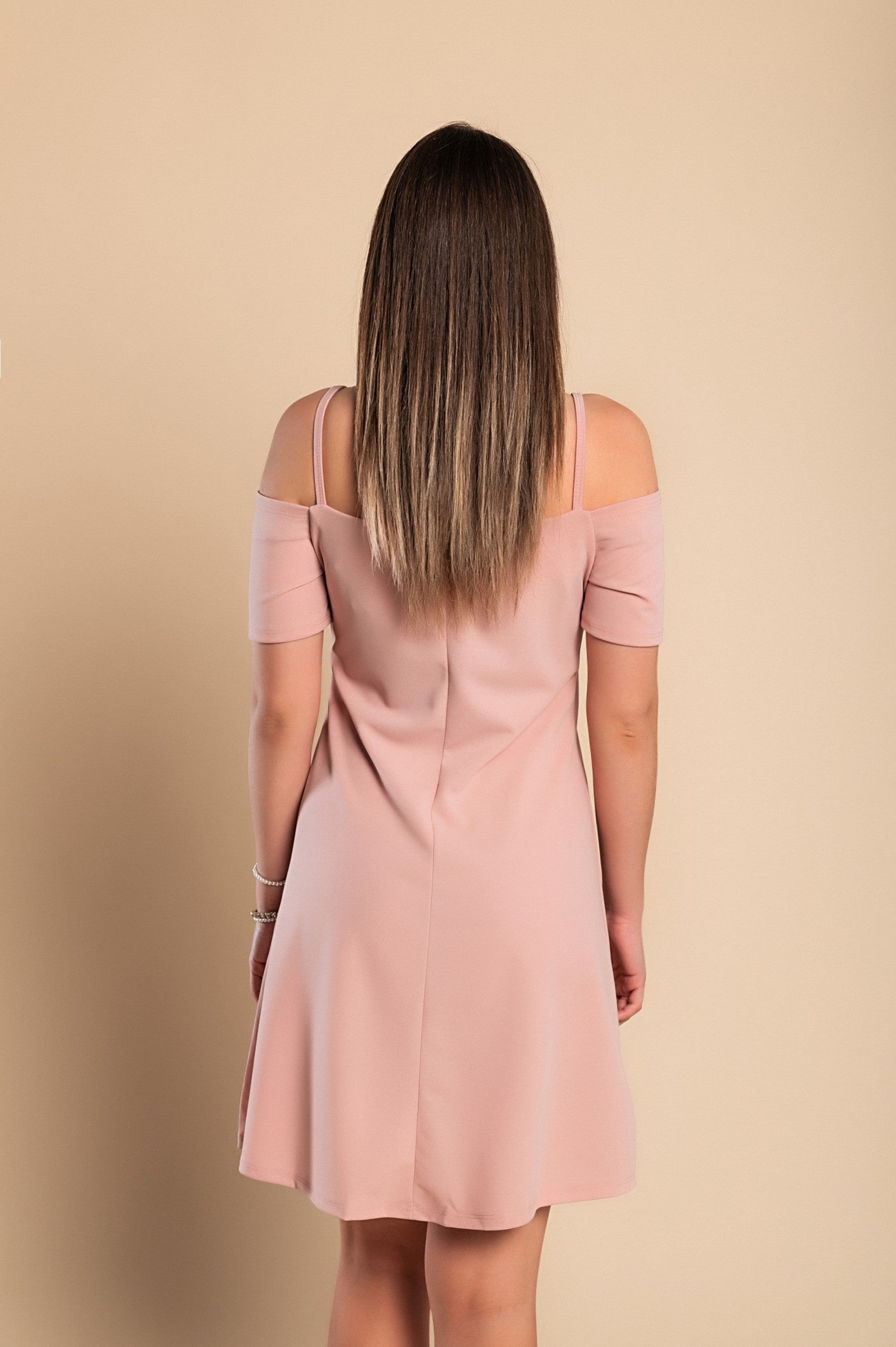 Elegant pink off shoulder strappy mini dress with short sleeves and loose skirt, perfect for casual and formal occasions.