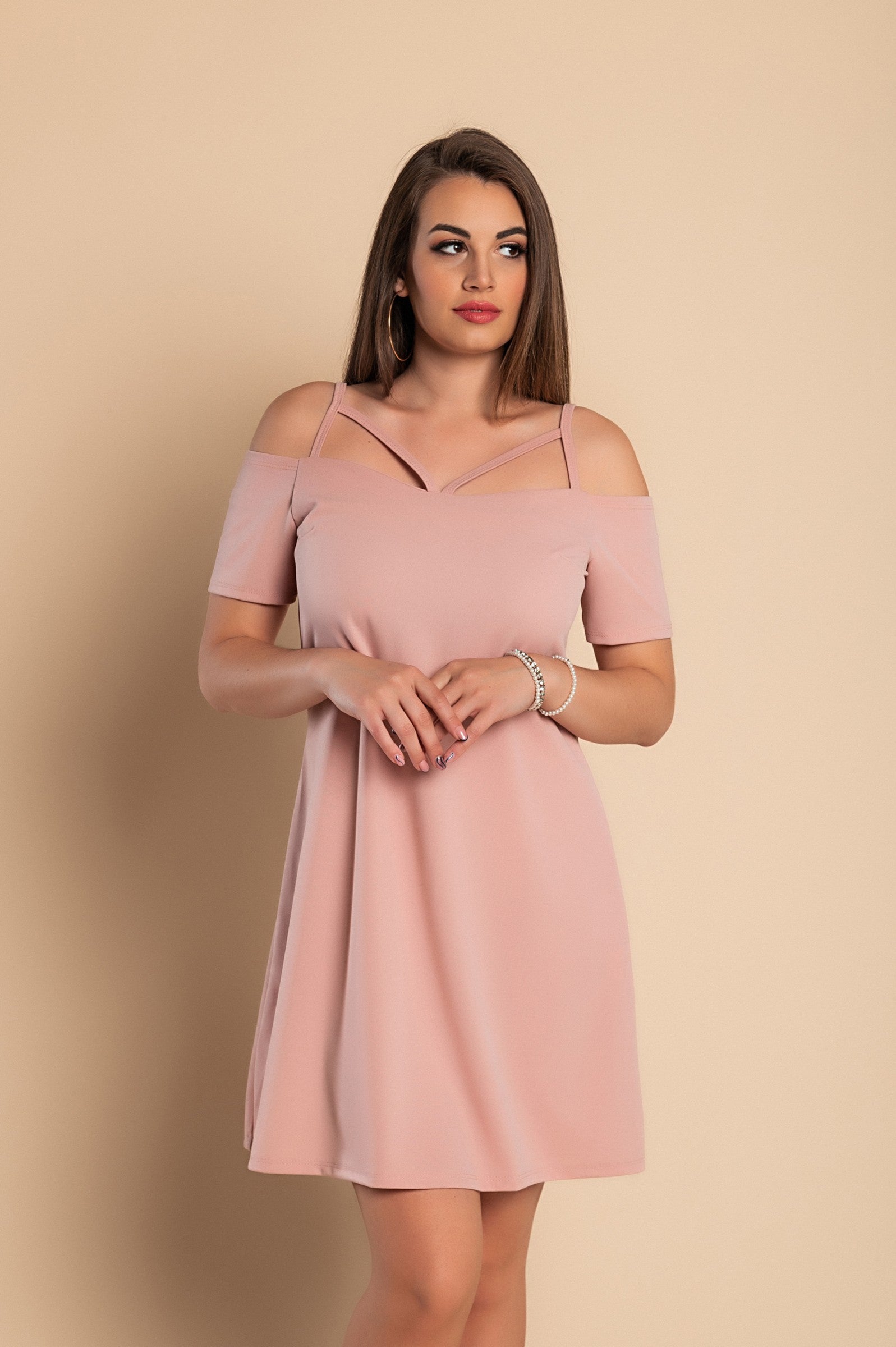 Elegant pink off shoulder strappy mini dress with short sleeves and loose skirt, perfect for casual and formal occasions.