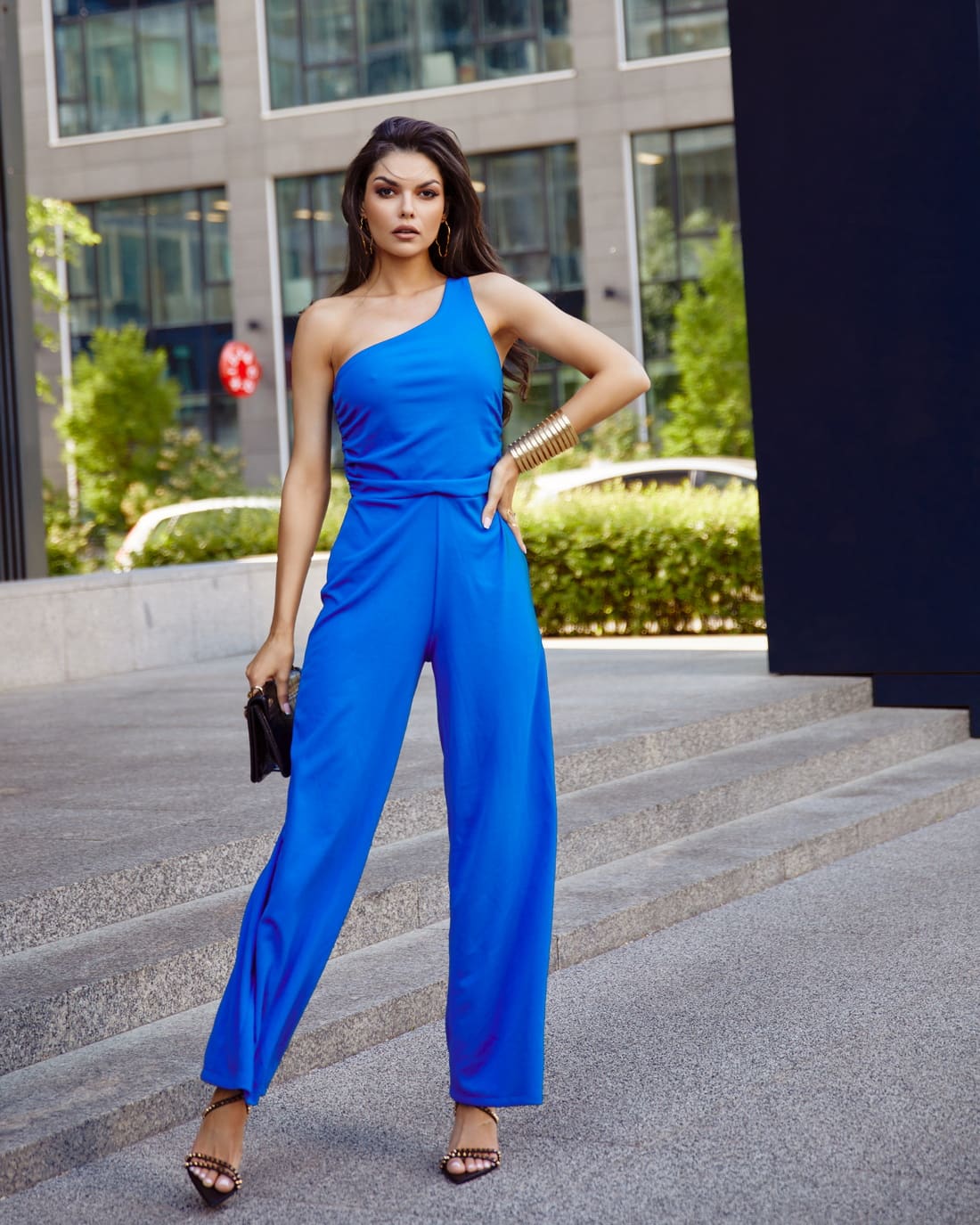 Elegant cornflower blue one-shoulder jumpsuit with wide legs, showcasing a stylish design perfect for various occasions.