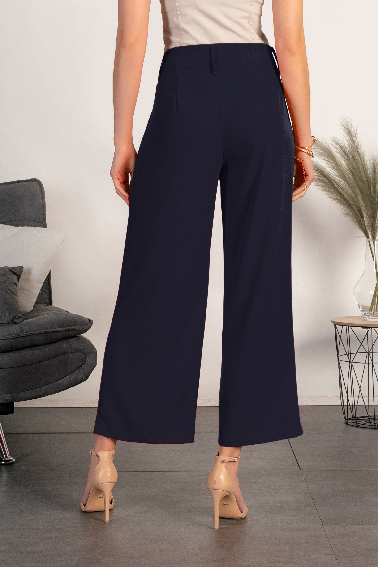 Elegant dark blue pants with loose legs, featuring a zip closure and metal hooks, made in Italy.