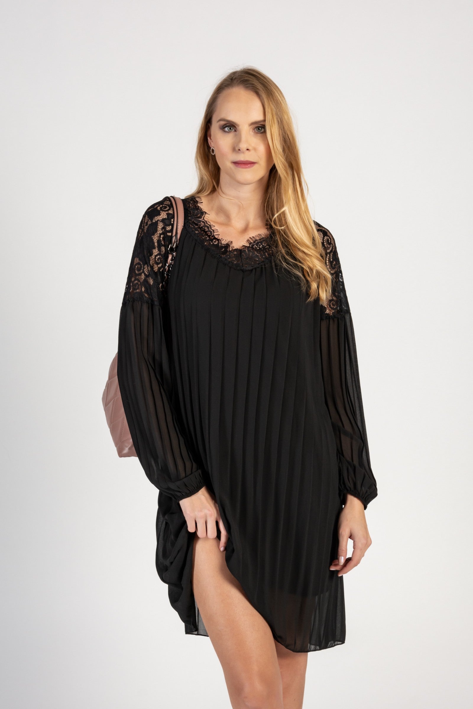 Elegant black pleated mini dress with lace inserts, featuring long loose sleeves and a 'V' neckline, perfect for various occasions.