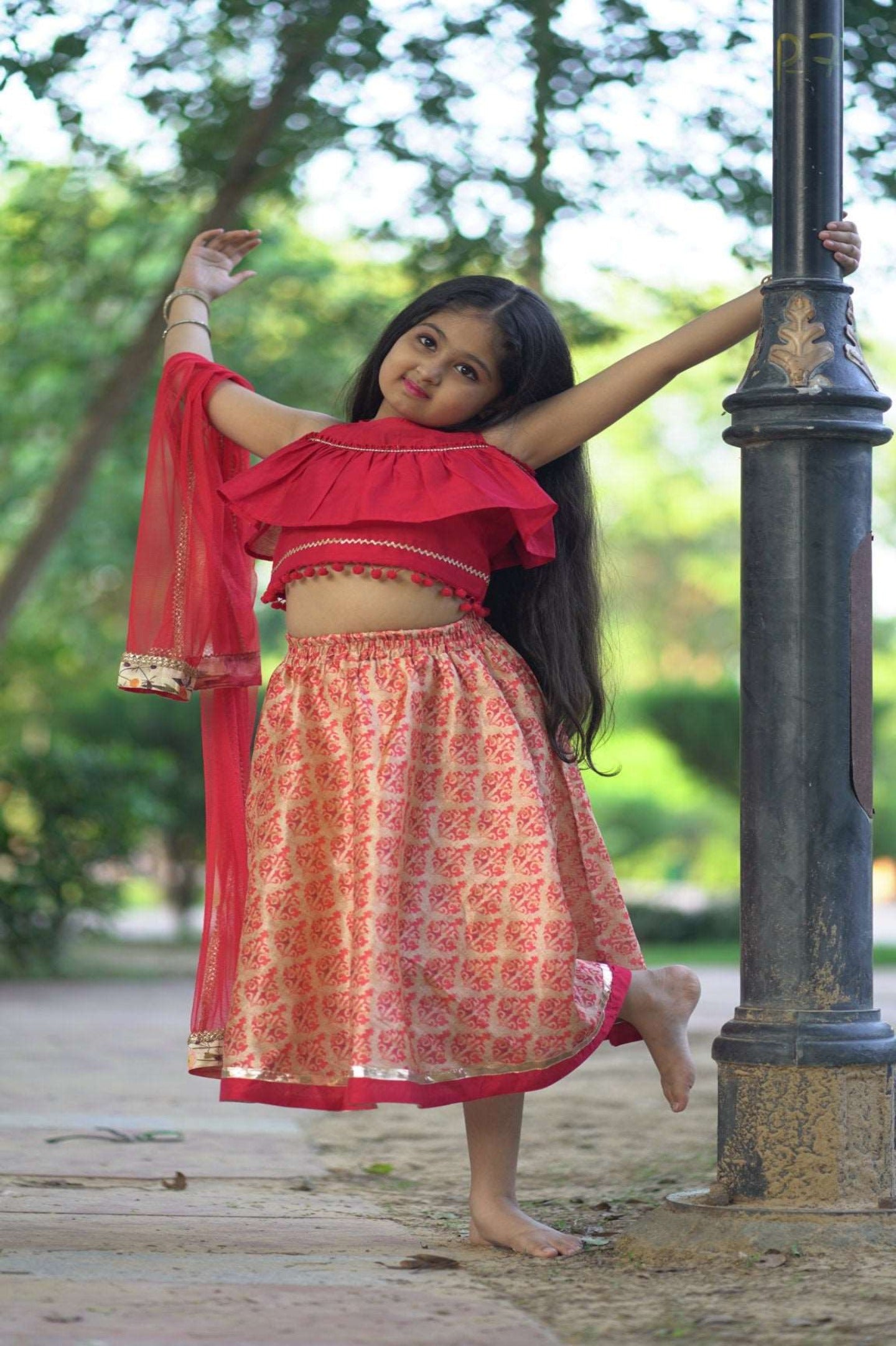 Elegant red Chanderi Lehenga Choli kids set featuring a soft fabric, relaxed fit lehenga, stylish choli, and matching dupatta.