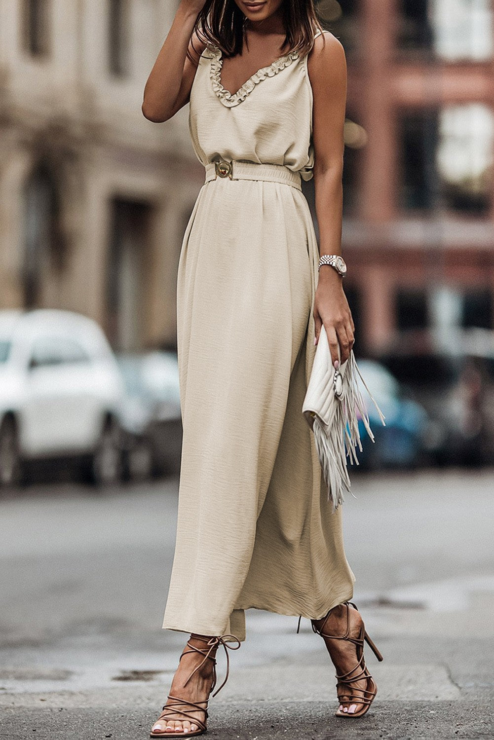 Elegant apricot ruffled maxi dress featuring spaghetti straps and a deep V-neckline with a loose skirt and elastic waist.