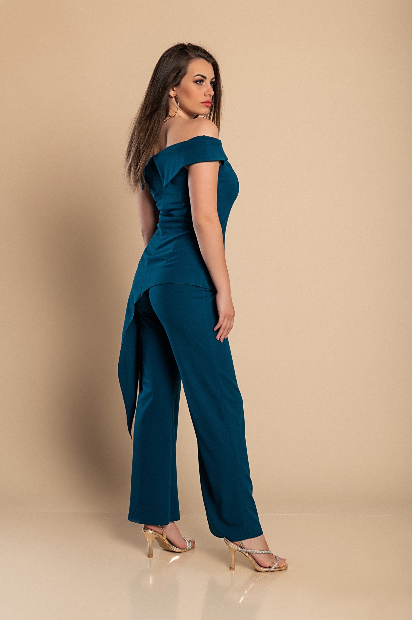 Elegant asymmetrical top and loose trousers set in petrol color, showcasing a bateau neckline and elastic waist.