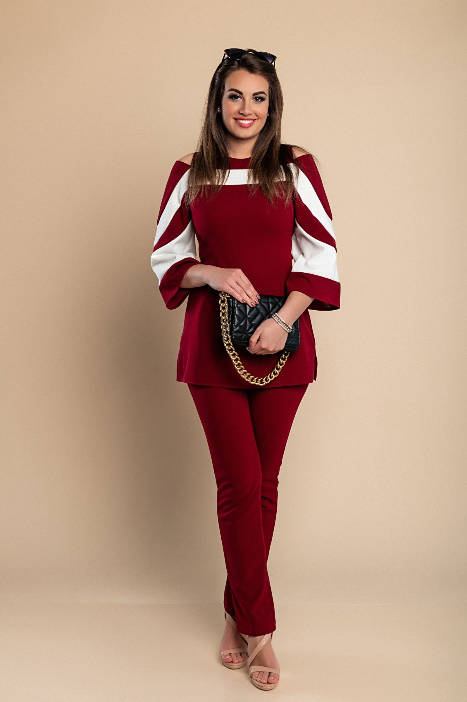 Elegant burgundy top and pants set featuring off-the-shoulder neckline and 3/4 bell sleeves, made from soft, high-quality fabric.