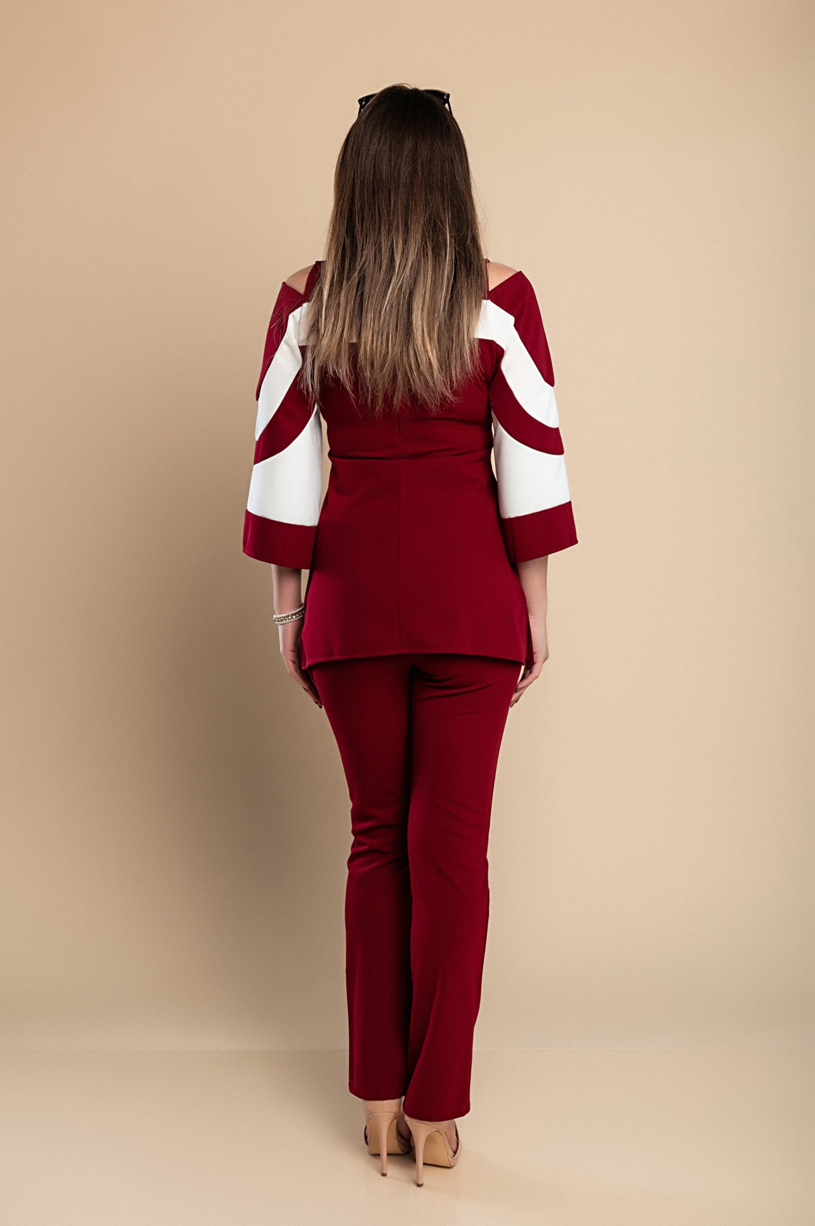 Elegant burgundy top and pants set featuring off-the-shoulder neckline and 3/4 bell sleeves, made from soft, high-quality fabric.