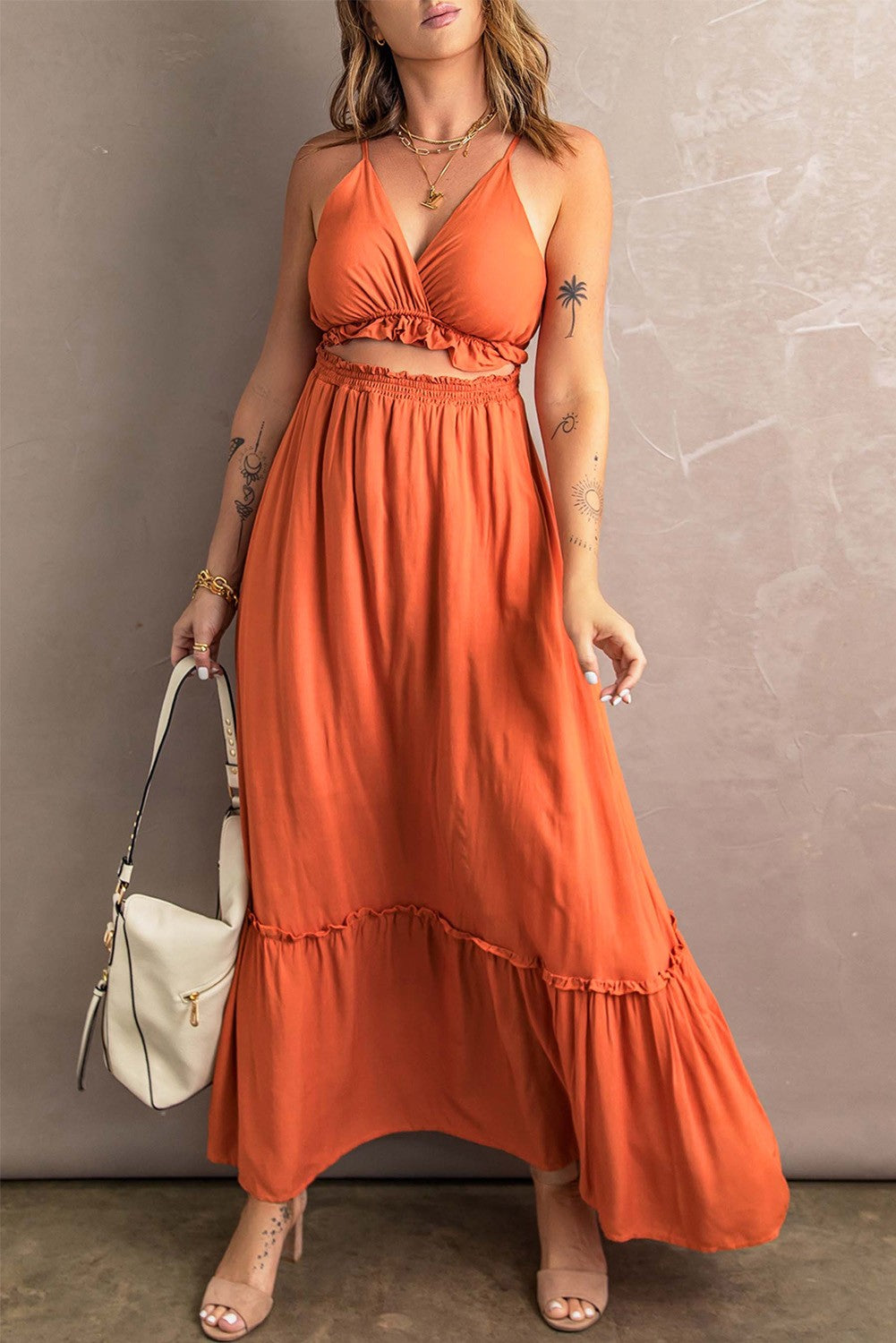 Elegant orange sheer dress with ruffles, featuring a sleeveless design and a flattering neckline, perfect for various occasions.