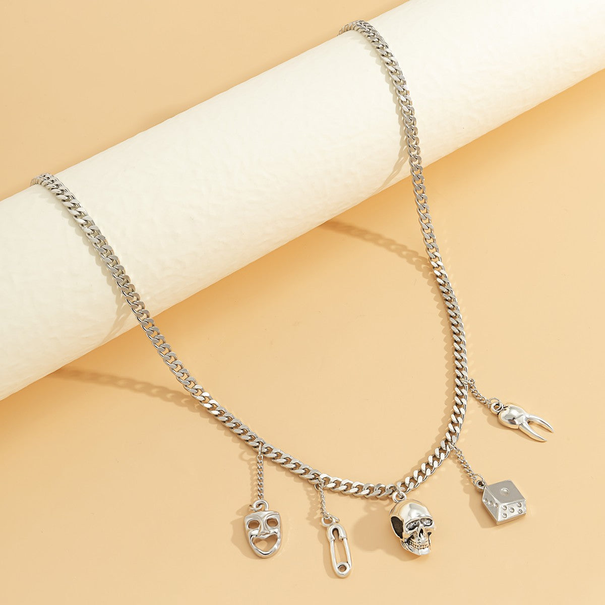 Elegant thin silver necklace featuring various shaped pendants, perfect for enhancing any outfit.