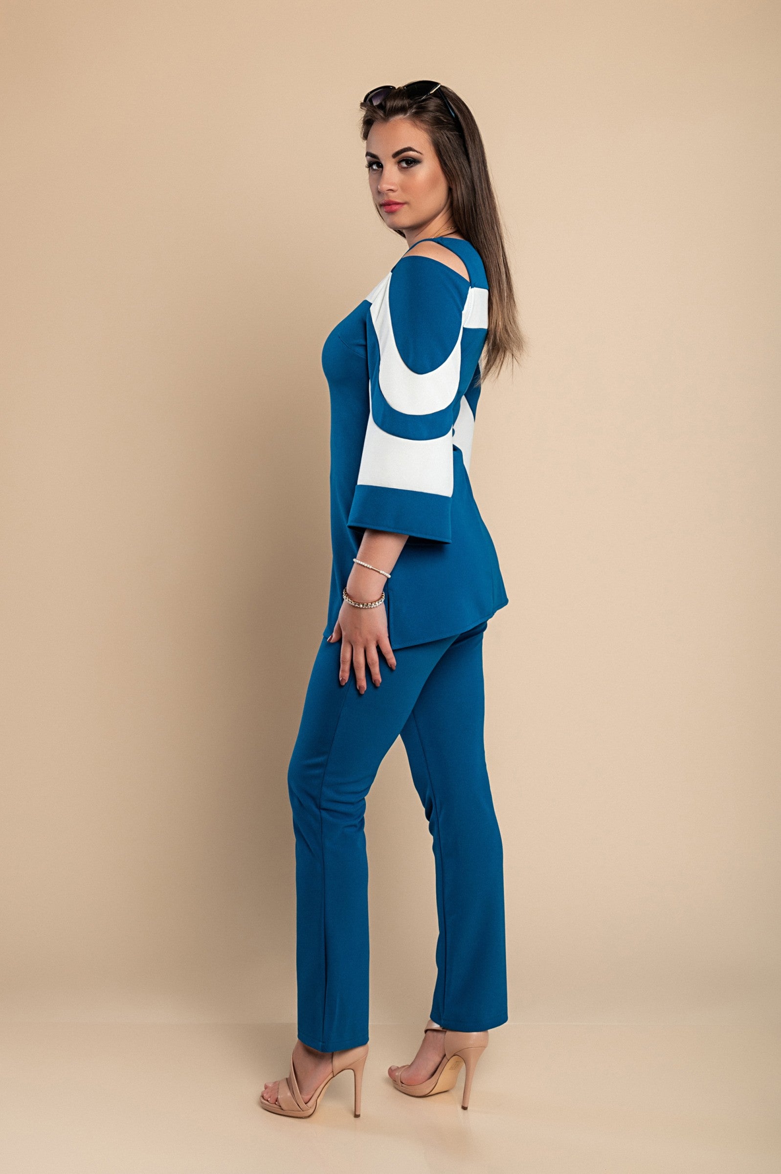 Elegant petrol top and pants set featuring a two-color design, off-the-shoulder neckline, and 3/4 bell sleeves, made in Italy.