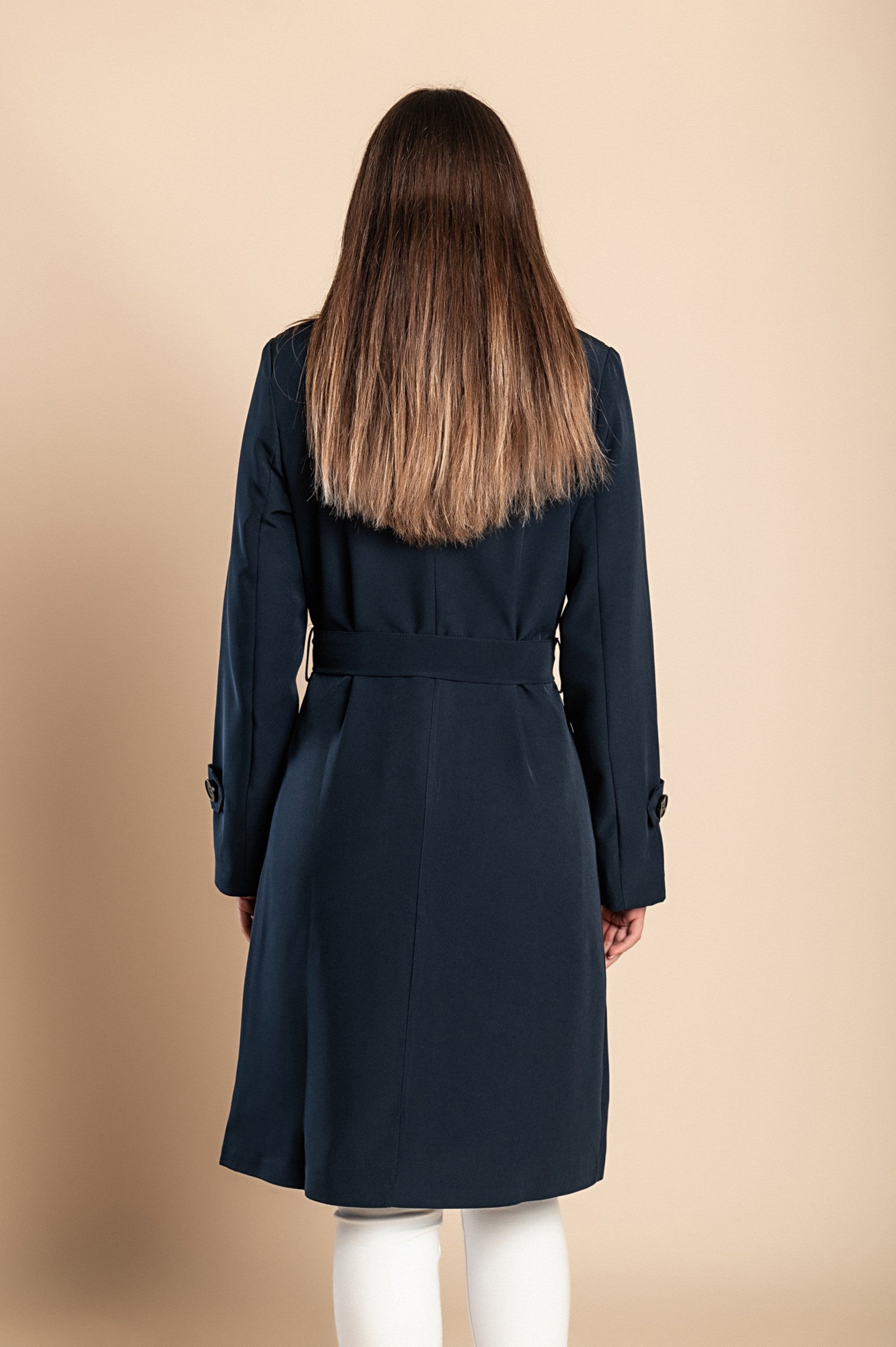 Elegant dark blue trench coat with buttons, featuring a classic collar and knee-length design, made in Italy.