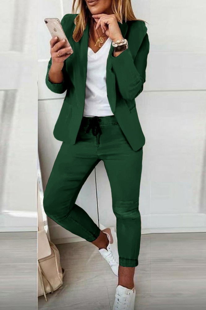 Elegant green trousers and blazer set Estrena, featuring a classic collar, long sleeves, and slim fit trousers with an elasticated drawstring waist.