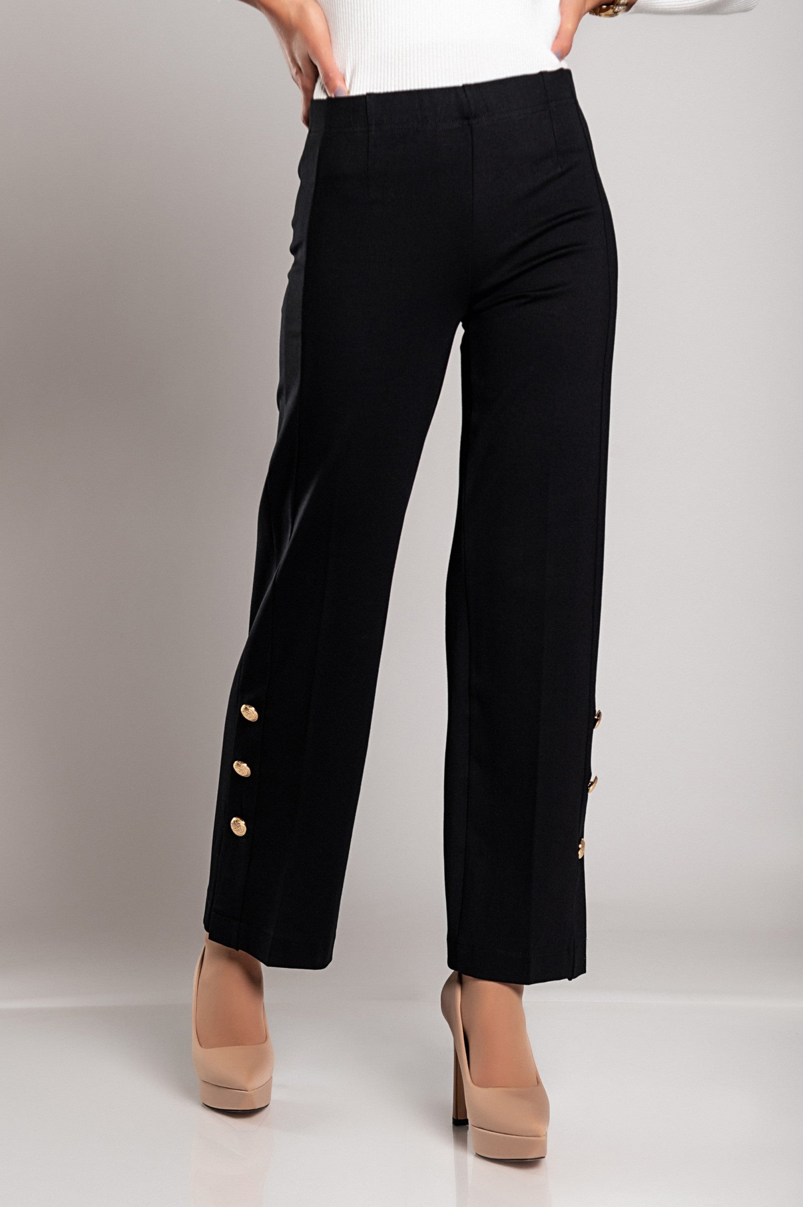 Elegant black trousers featuring decorative buttons and an elasticated waist, designed for comfort and style.