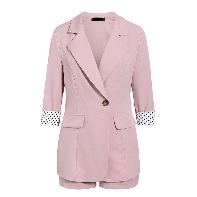 Elegant two-piece women blazer suit featuring polka dots, single button closure, and button pockets, ideal for office wear.