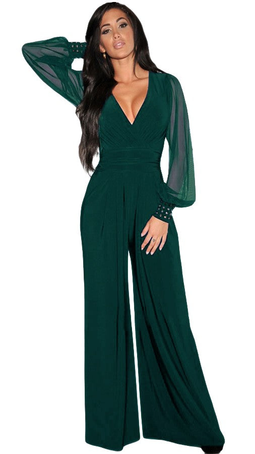 Elegant V-Neck Jumpsuit Georgina in Dark Green featuring long transparent sleeves and gold rivets, perfect for formal events.