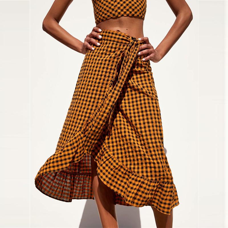 Elegant yellow plaid ruffle midi skirt featuring a high waist and bow detail, perfect for women's fashion.