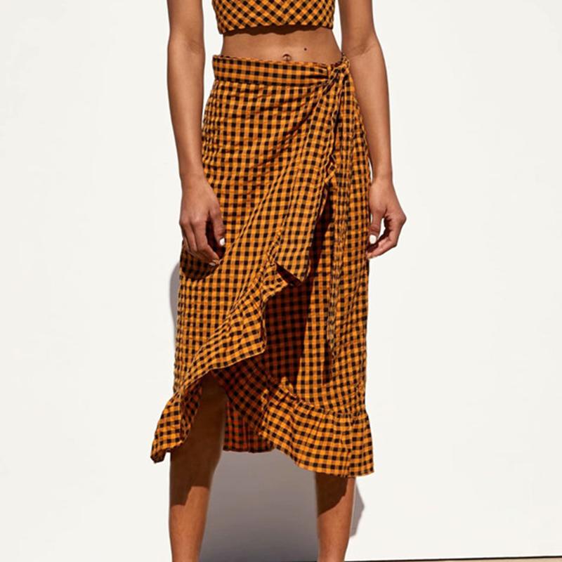 Elegant yellow plaid ruffle midi skirt featuring a high waist and bow detail, perfect for women's fashion.