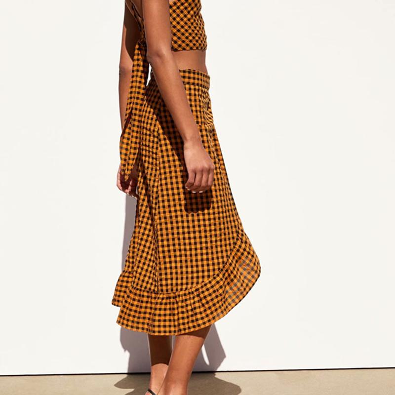 Elegant yellow plaid ruffle midi skirt featuring a high waist and bow detail, perfect for women's fashion.